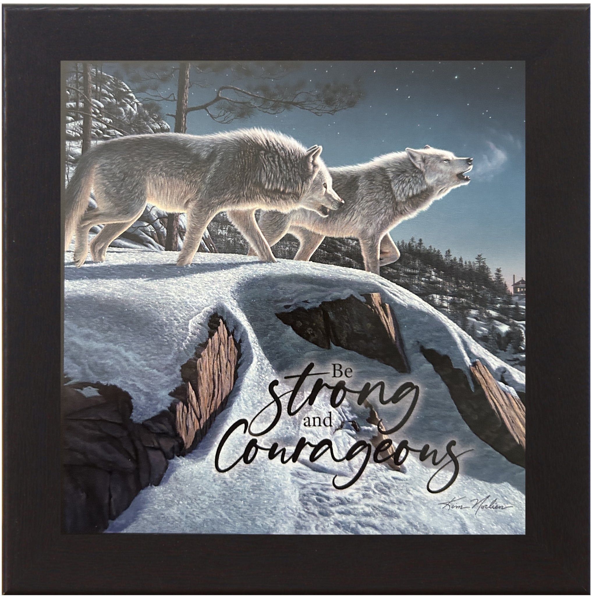 Winter wall art by Kim Norlien featuring two wolves on a snowy cliff with mountains and a glowing cabin in the distance – “Be Strong and Courageous” quote