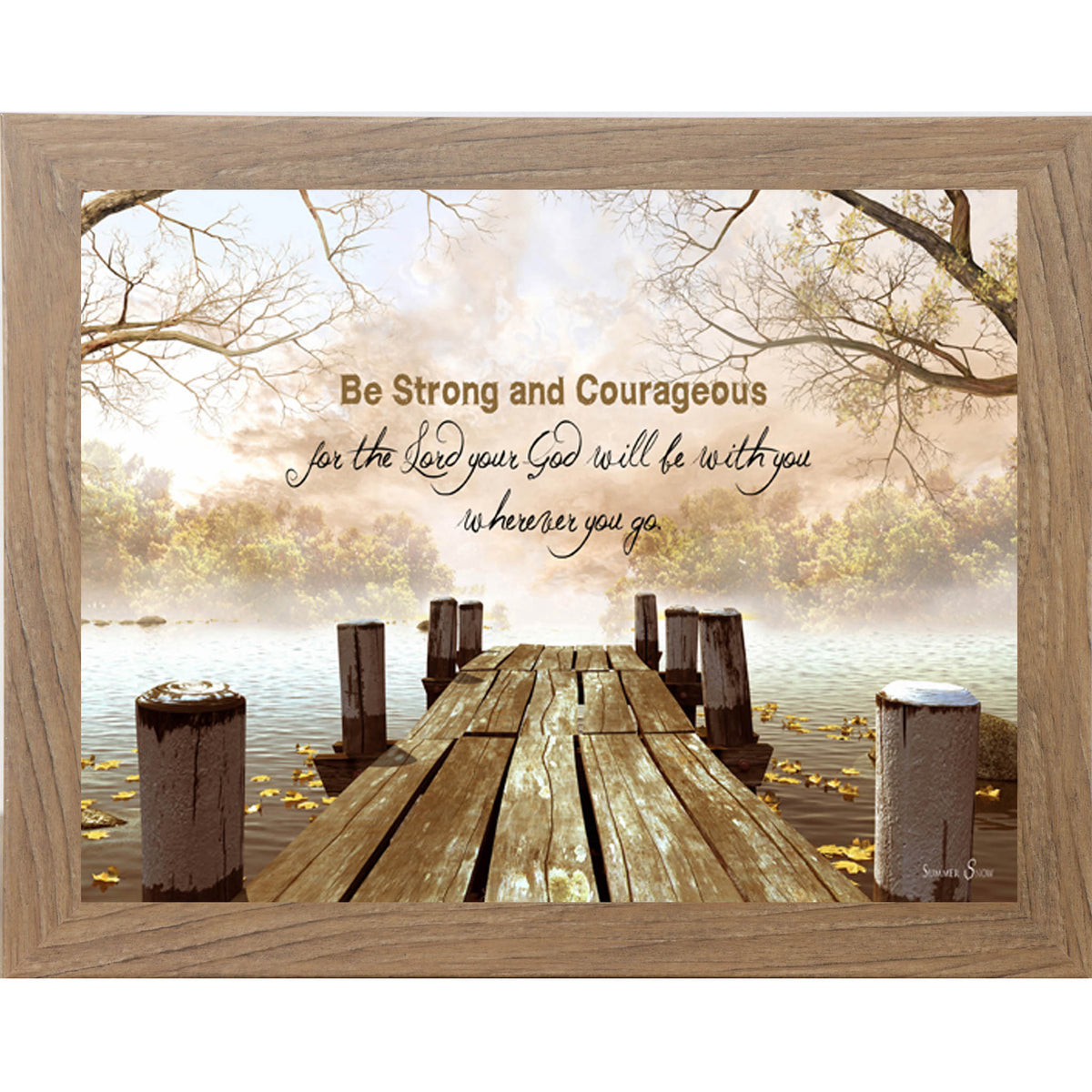 Framed scripture wall art featuring a wooden pier extending into a calm lake with fallen leaves and the words Be Strong and Courageous for the Lord your God will be with you wherever you go