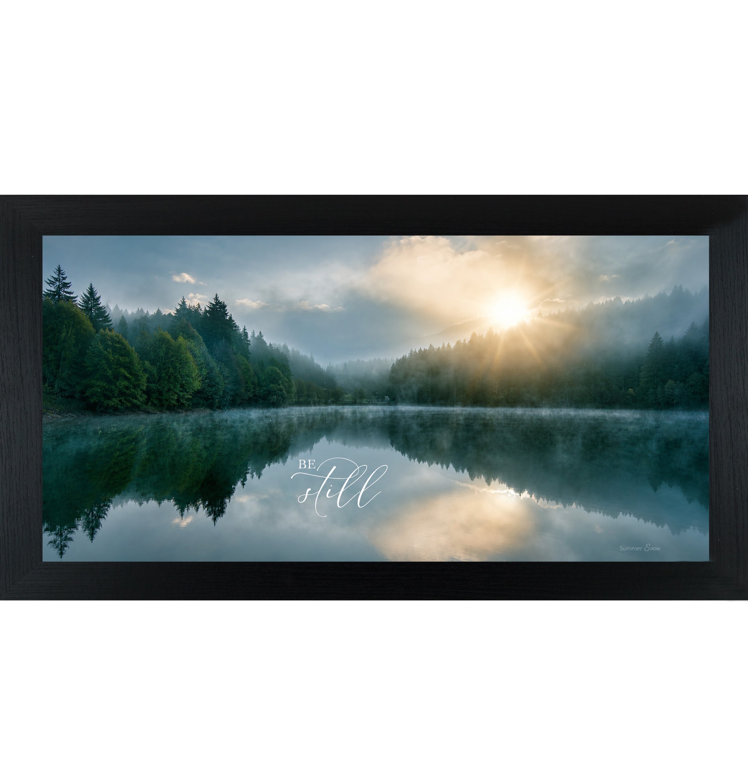 Black framed wide landscape Christian scripture wall art featuring misty lake sunrise with pine forest reflection and golden sun with the words Be Still — SB765