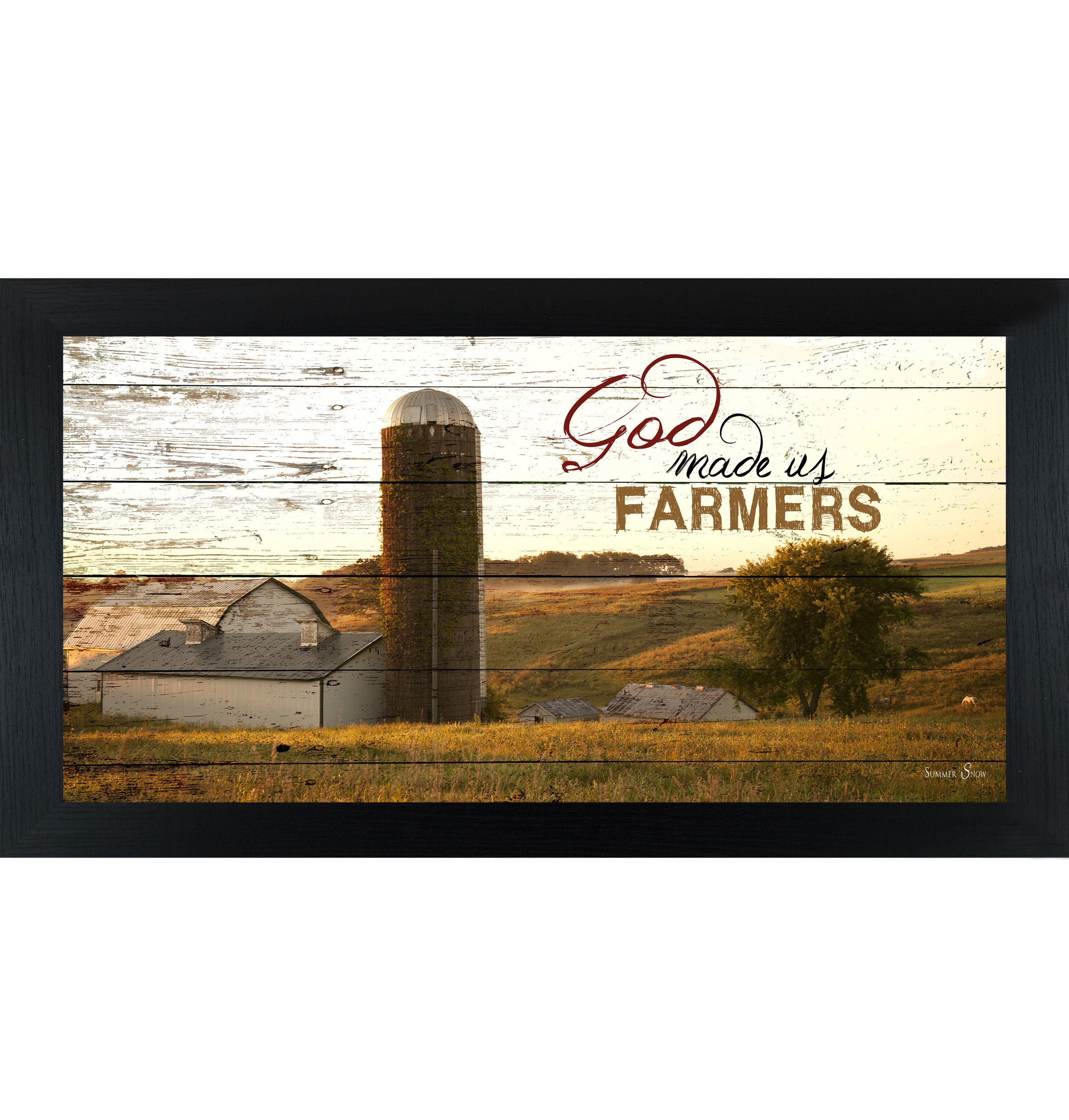 Black framed wide panoramic farmhouse wall art featuring a white barn and silo on rolling golden hills with pallet wood background and the words God Made Us Farmers
