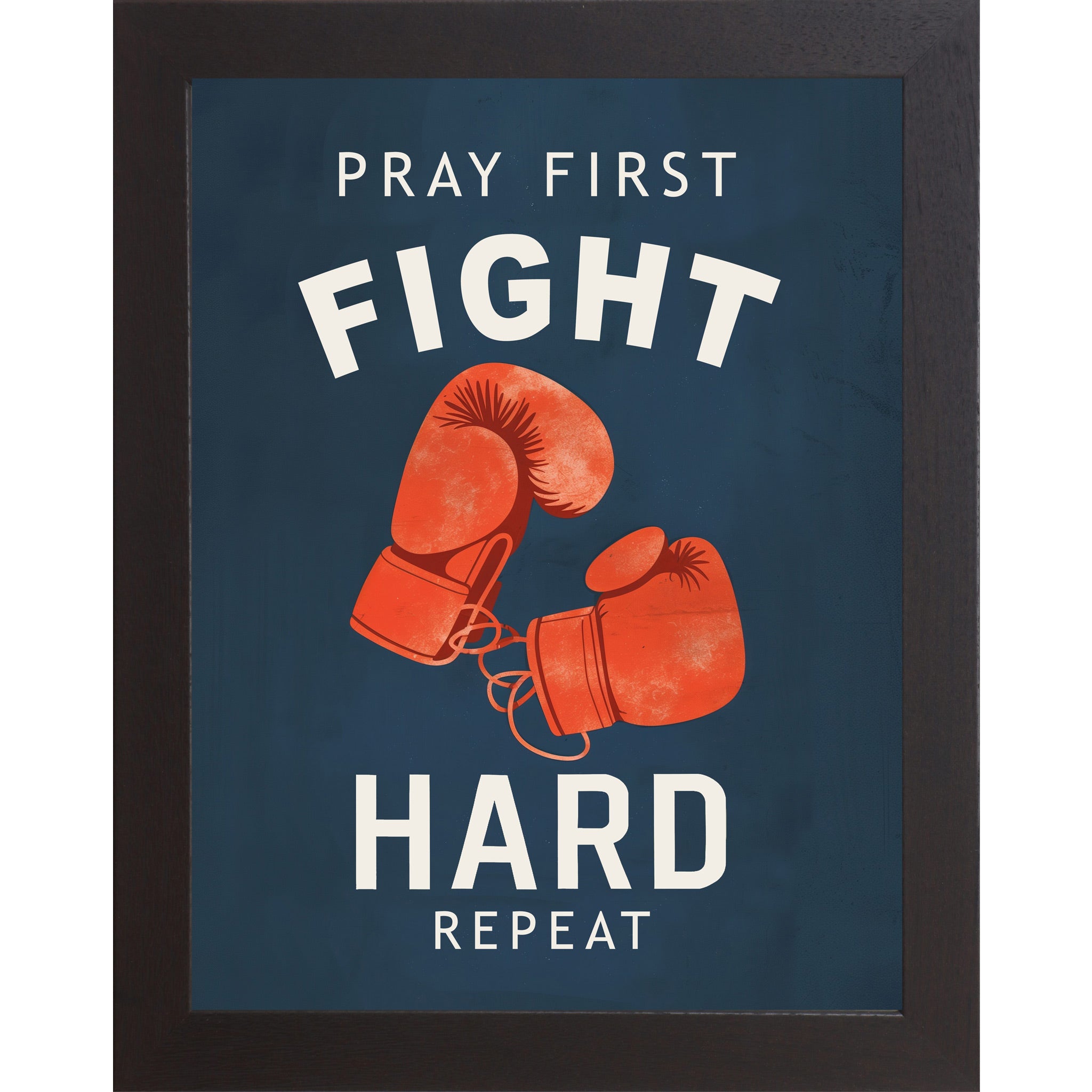 Black framed portrait Christian boxing wall art on navy blue background with bold cream varsity typography and vivid red boxing gloves with the words Pray First Fight Hard Repeat — SB262