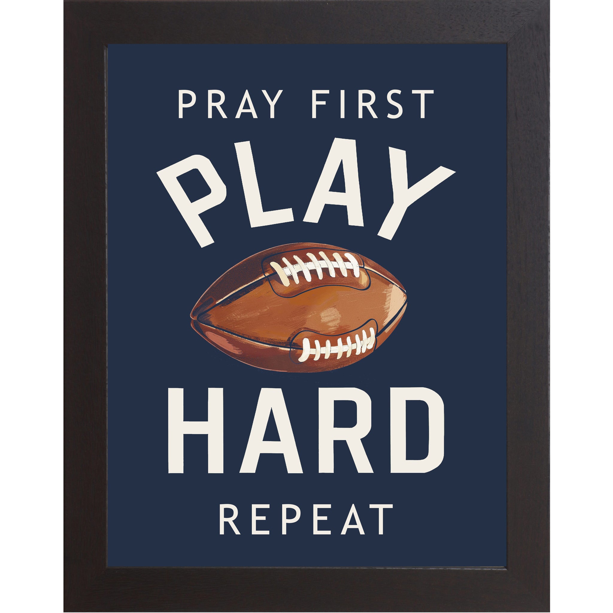 Black framed portrait Christian football wall art on navy blue background with bold cream varsity typography and vivid watercolor football with the words Pray First Play Hard Repeat — SB260