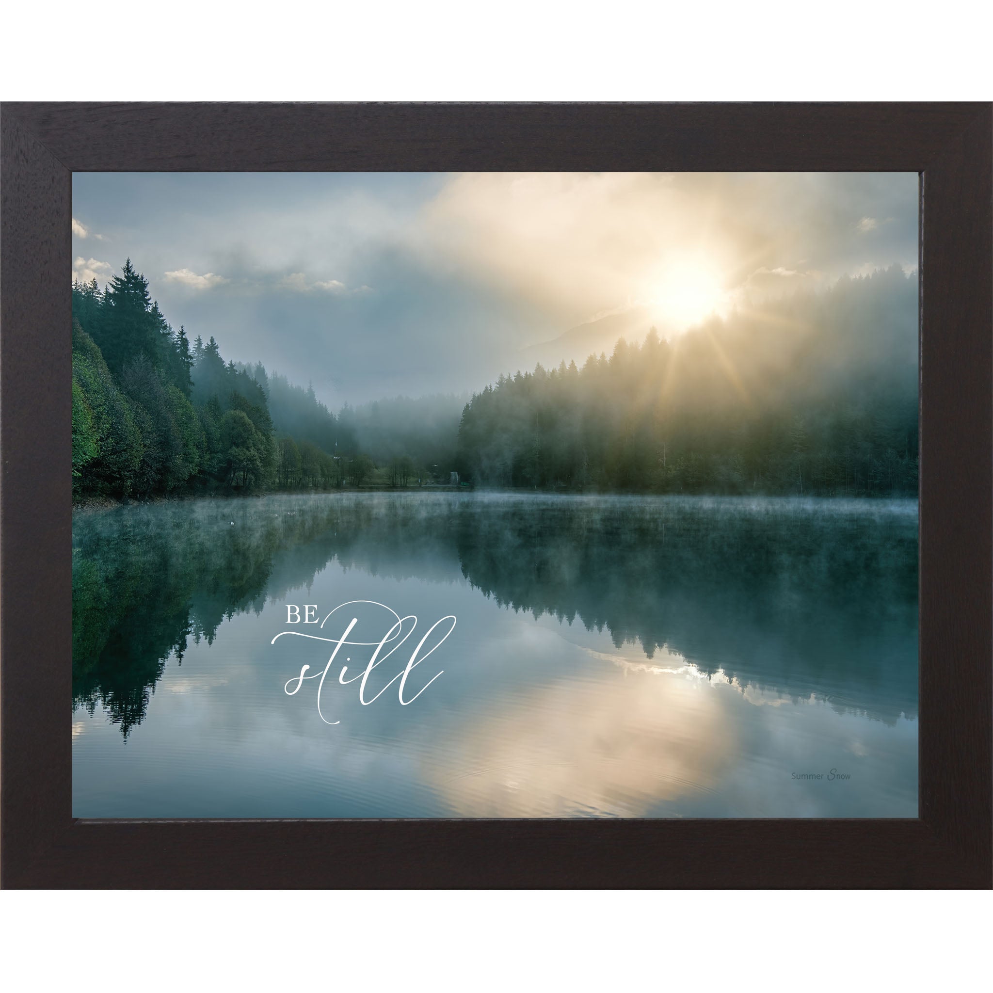 Black framed landscape Christian wall art with realistic lake reflection of trees and sunrise with the words "Be Still" reflected in the water Psalm 46:10