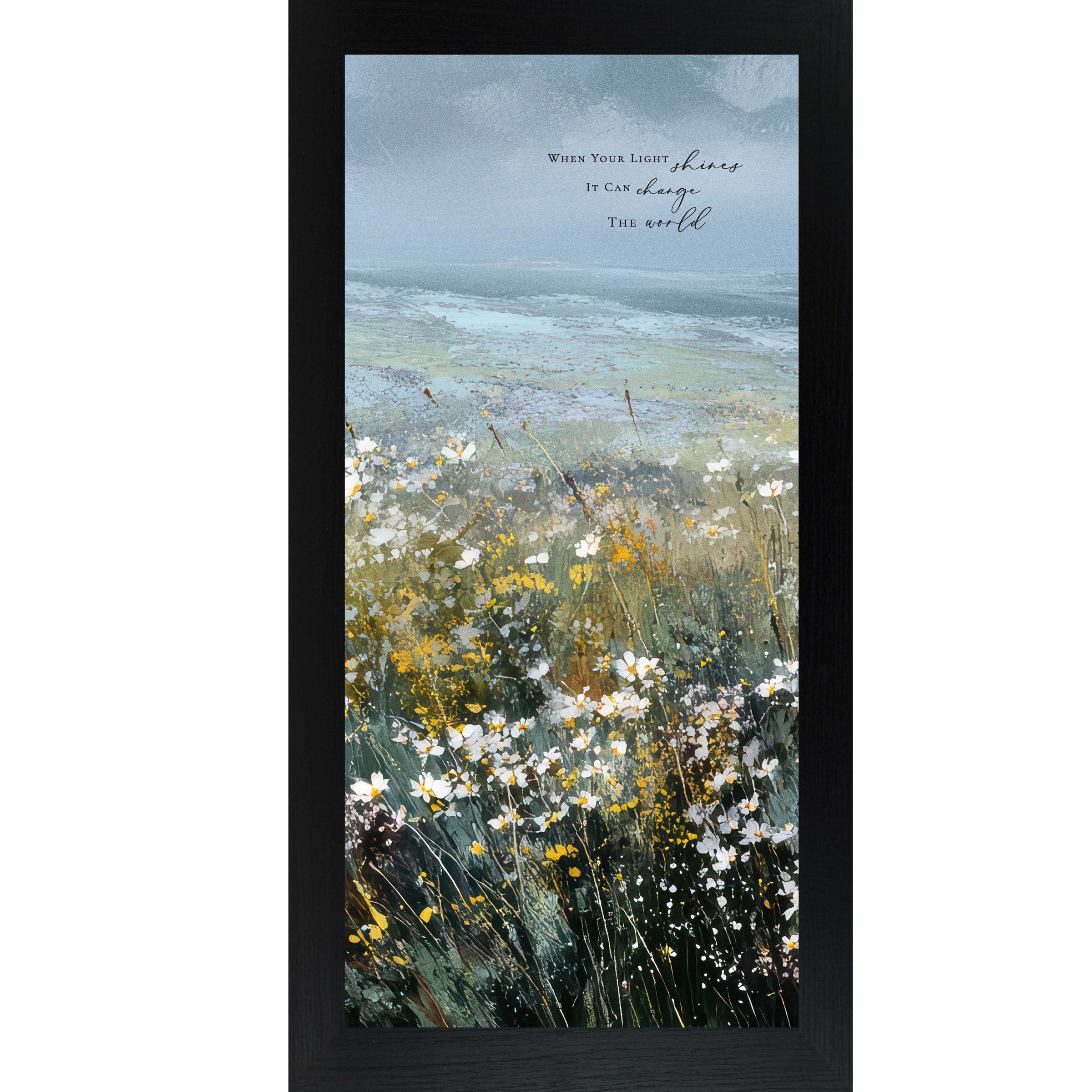 Black color Framed inspirational wall art featuring a watercolor meadow of wildflowers in bloom with rolling fields and a soft blue sky. The artwork includes the quote “When Your Light Shines It Can Change The World.”