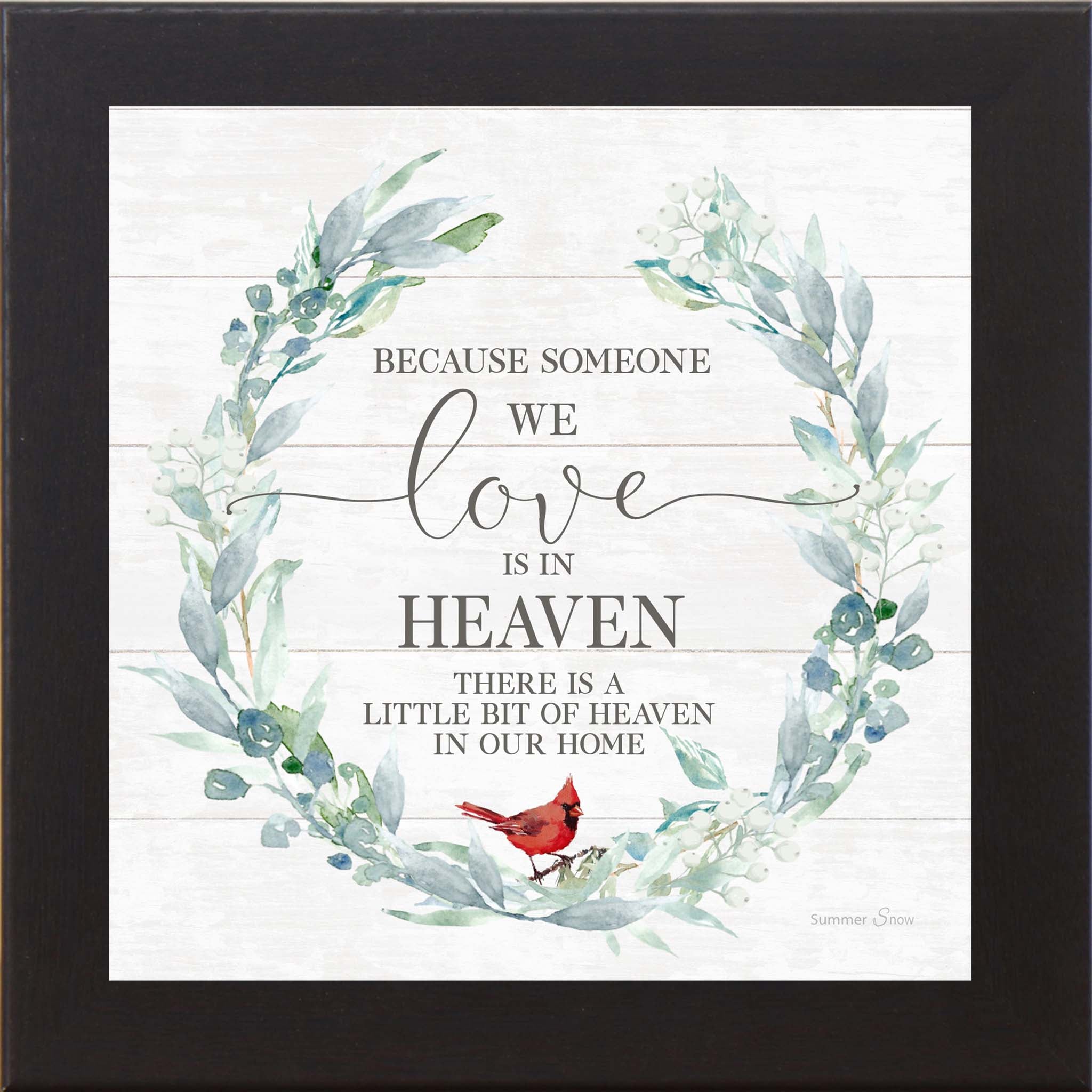 Black framed square cardinal sympathy wall art featuring a botanical wreath with red cardinal and the words "Because Someone We Love Is in Heaven There Is a Little Bit of Heaven in Our Home" on shiplap background — SS822