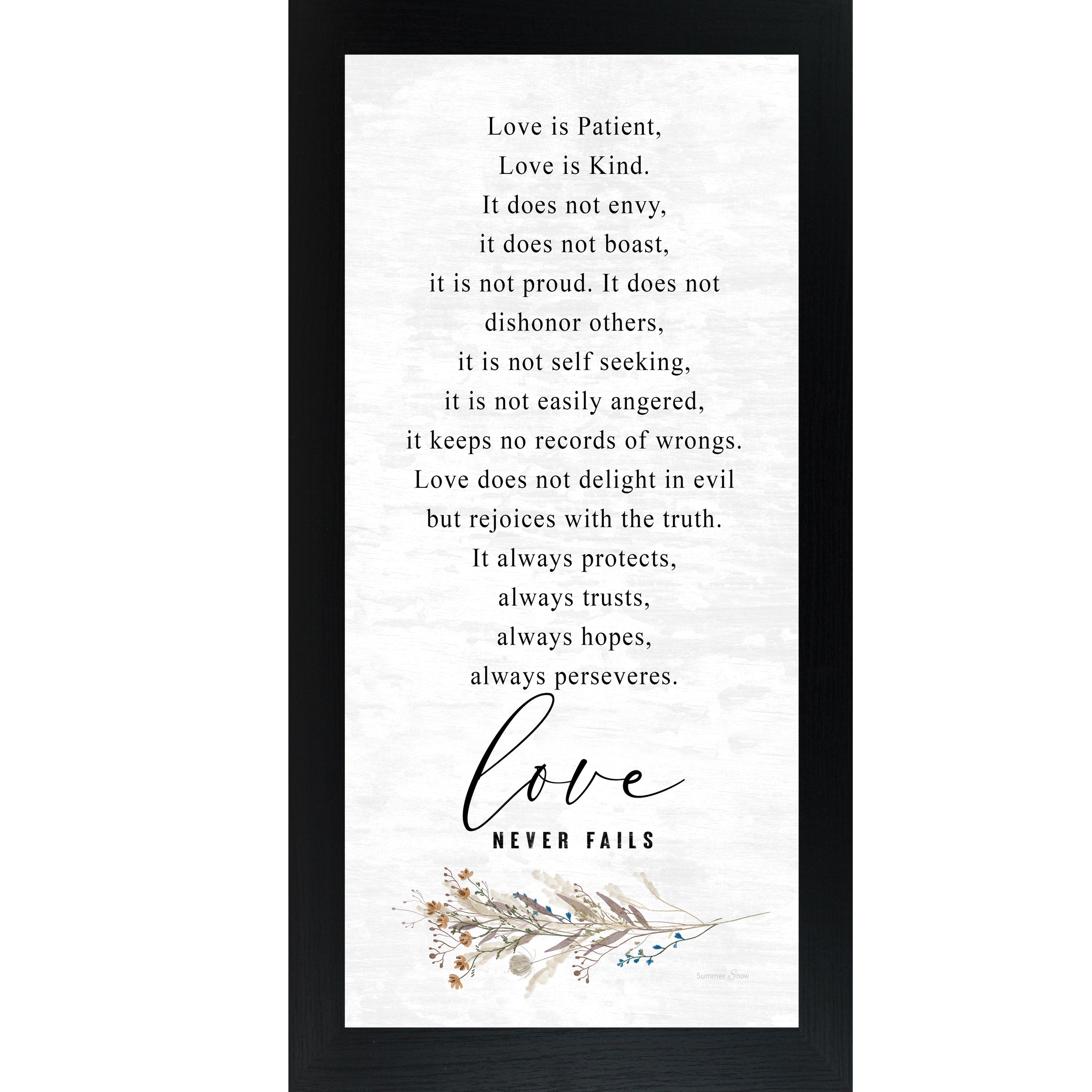 Black framed tall portrait Christian wall art featuring the full 1 Corinthians 13 scripture in elegant serif and flowing script with wildflower botanical sprig and the words "love Never Fails" — SN700