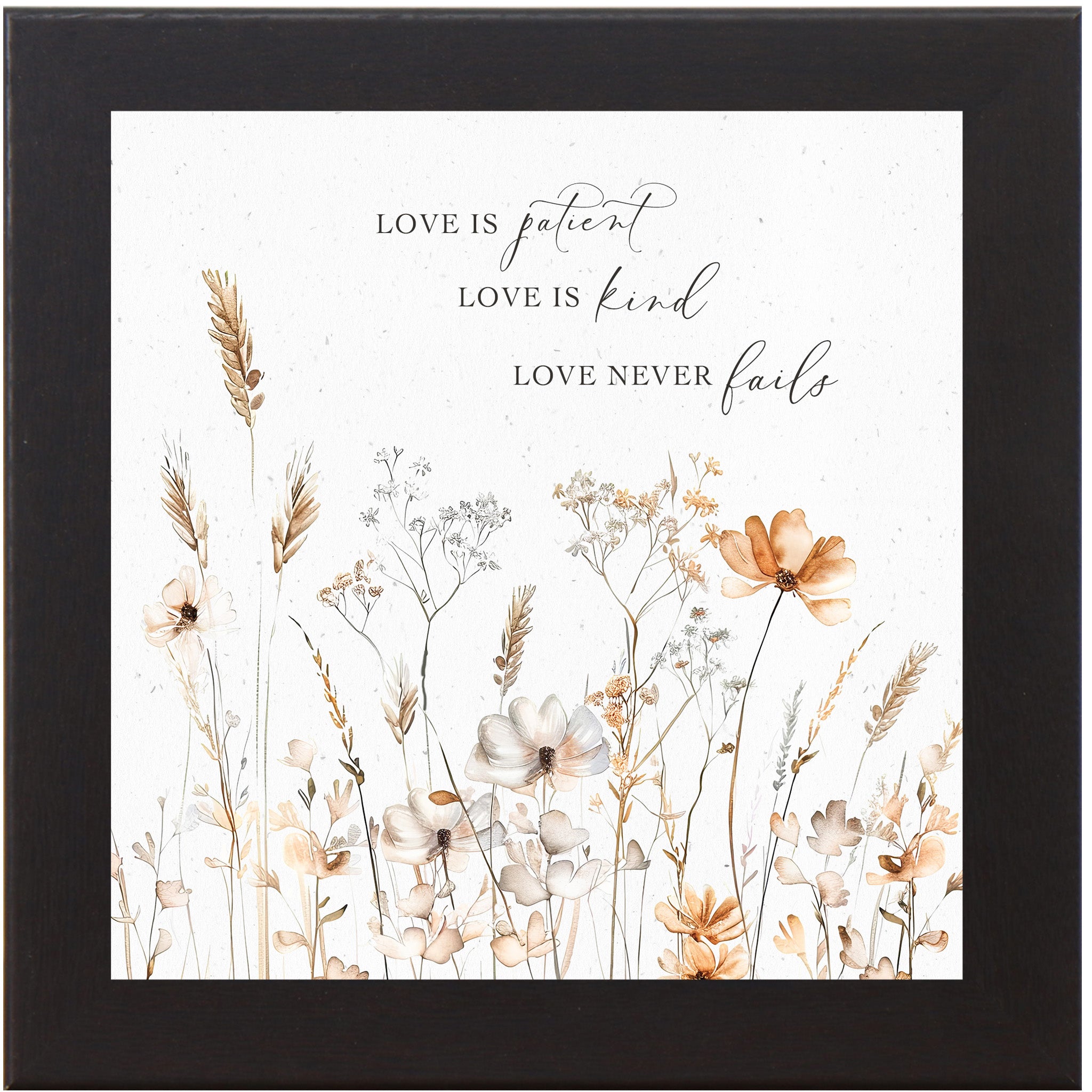 Black framed square pastel floral wall art on white background with petite watercolor peach and white flowers and the quote "Love is Patient Love is Kind Love Never Fails"