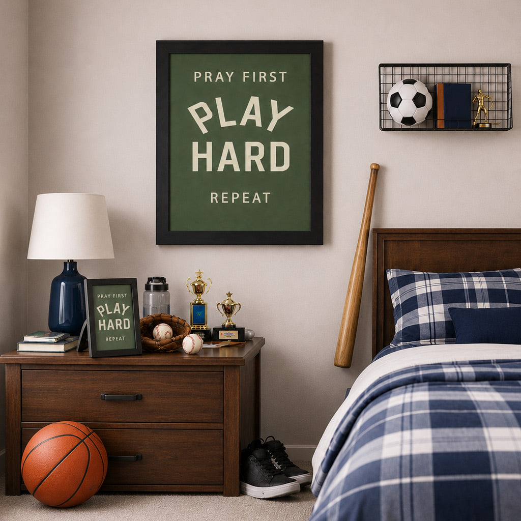 Boys sports bedroom with Pray First Play Hard Repeat wall art SB202 in black frame — larger size hanging on wall above nightstand with 8x10 easel back — baseball glove trophies soccer ball basketball and baseball bat in room setting