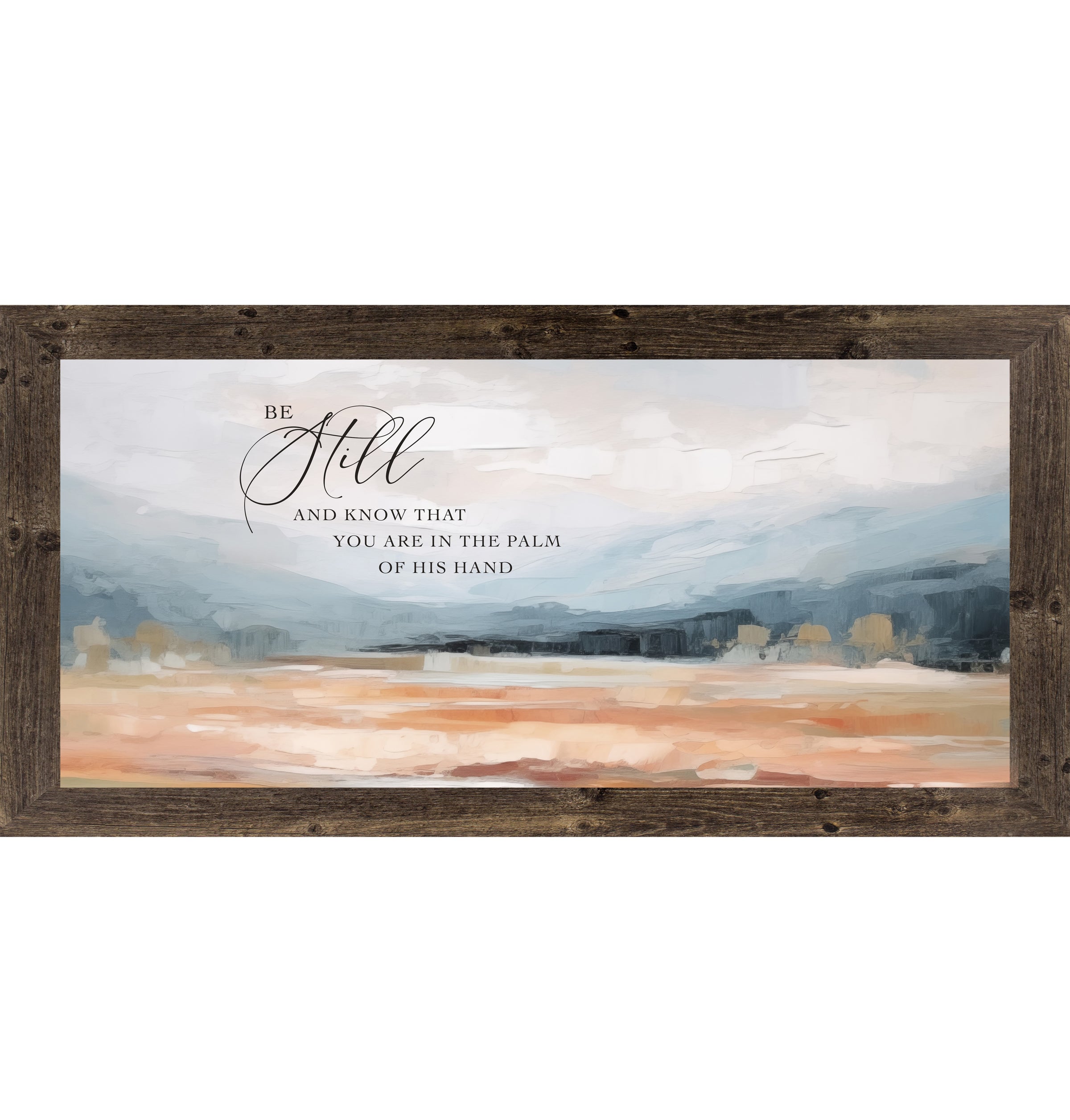 Natural Brown framed wide landscape Christian wall art with Be Still And Know That You Are In The Palm Of His Hand scripture in oversized script over dramatic blue-grey mountains and soft peach blush terracotta field