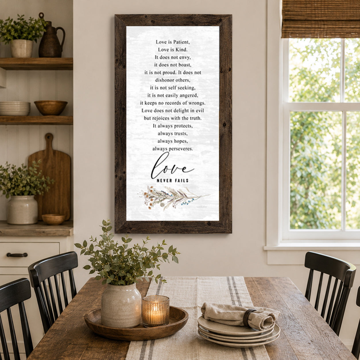 Farmhouse dining room with Love is Patient Love Never Fails tall portrait wall art SN700 in natural brown frame — 16x28 hanging on wall beside window above wooden dining table