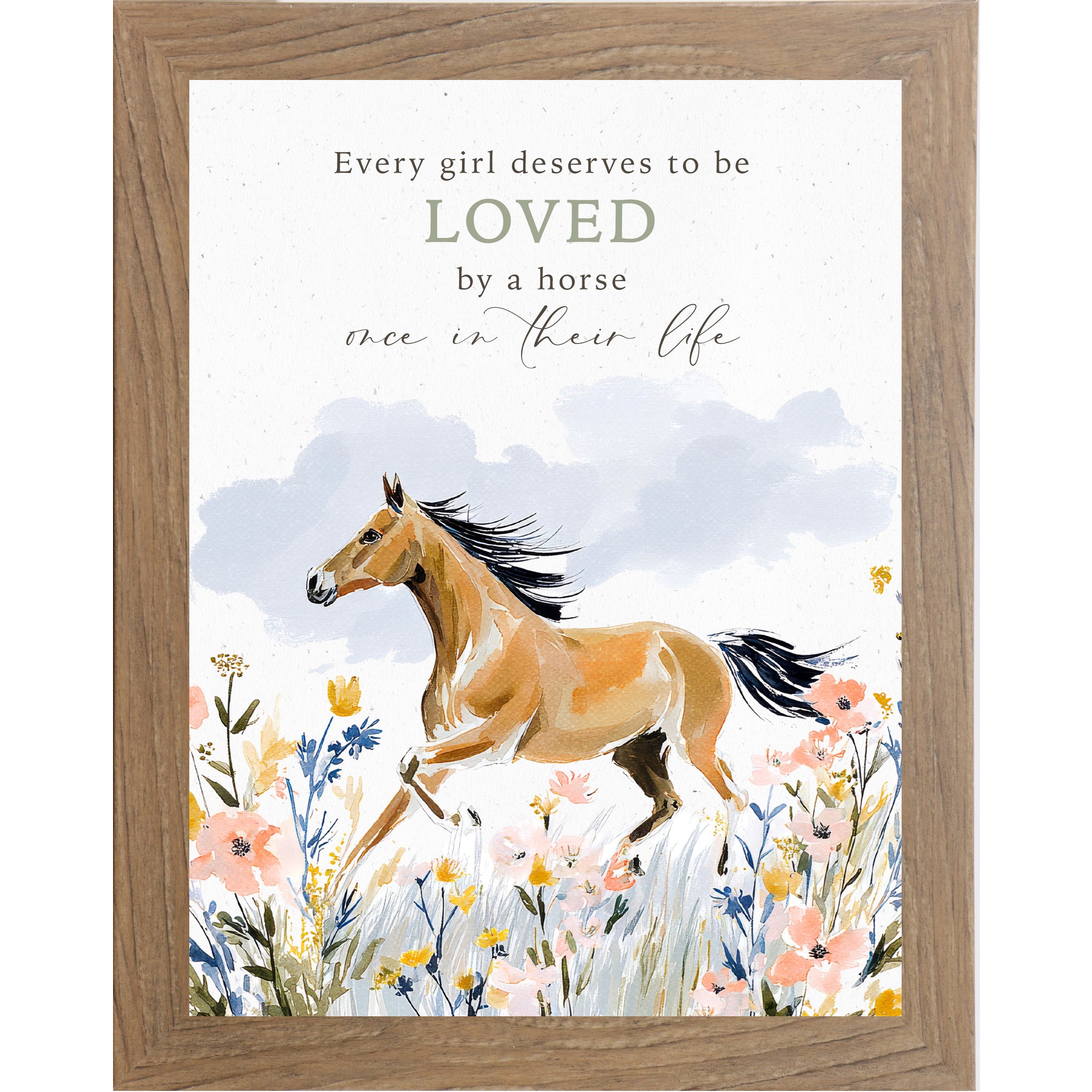 Farmtable framed portrait watercolor horse wall art with the words Every Girl Deserves to be Loved by a Horse Once in Their Life above a buckskin horse galloping through a pink yellow and blue wildflower meadow