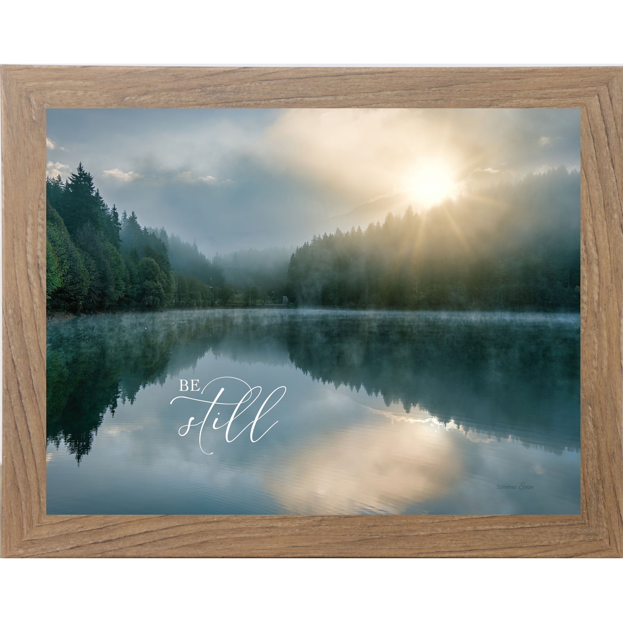 Farmtable framed landscape Christian wall art with realistic lake reflection of trees and sunrise with the words "Be Still" reflected in the water Psalm 46:10