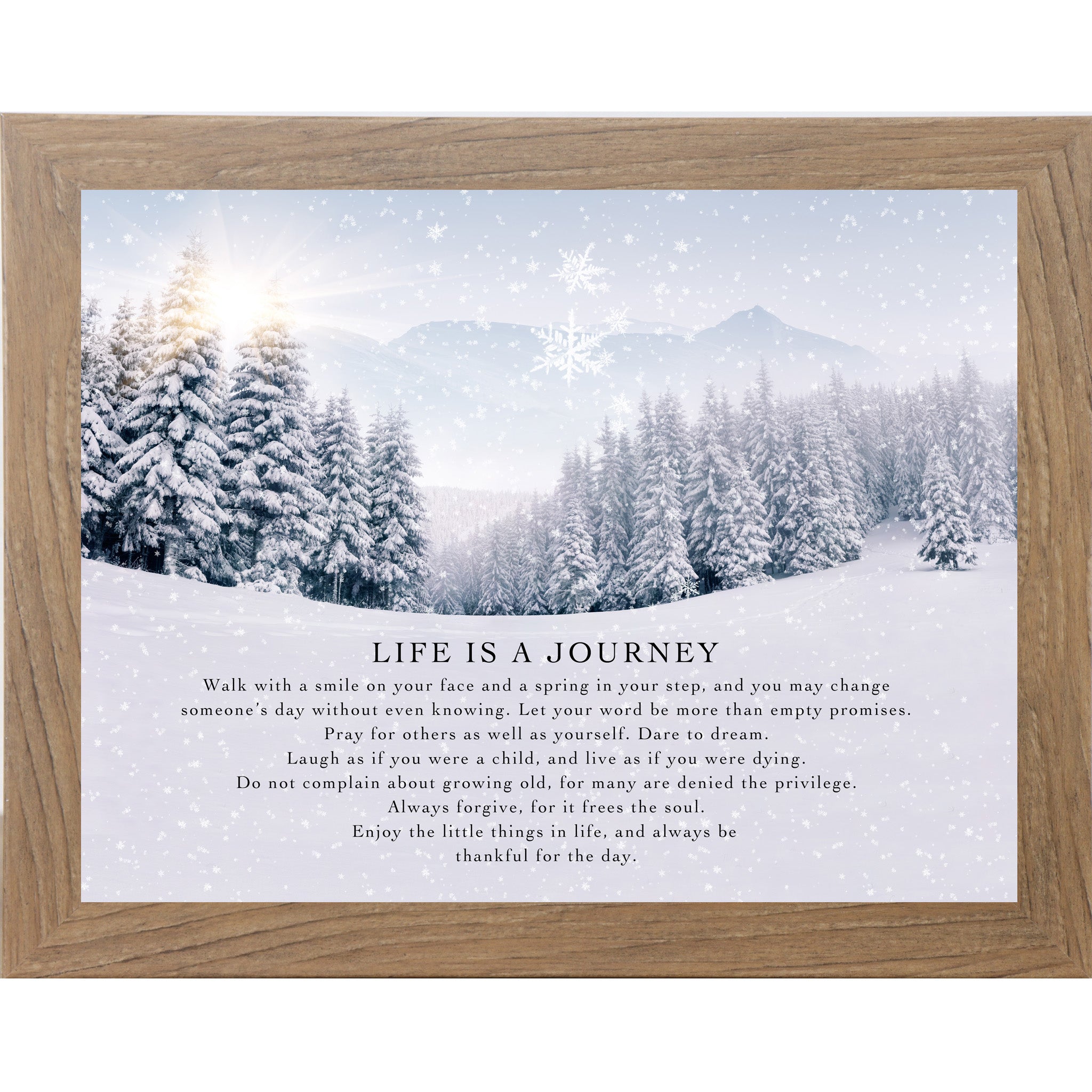 Farmtable framed landscape winter wall art featuring a sunlit snowy pine forest with falling snowflakes and the words "Life Is A Journey" followed by an inspirational life philosophy
