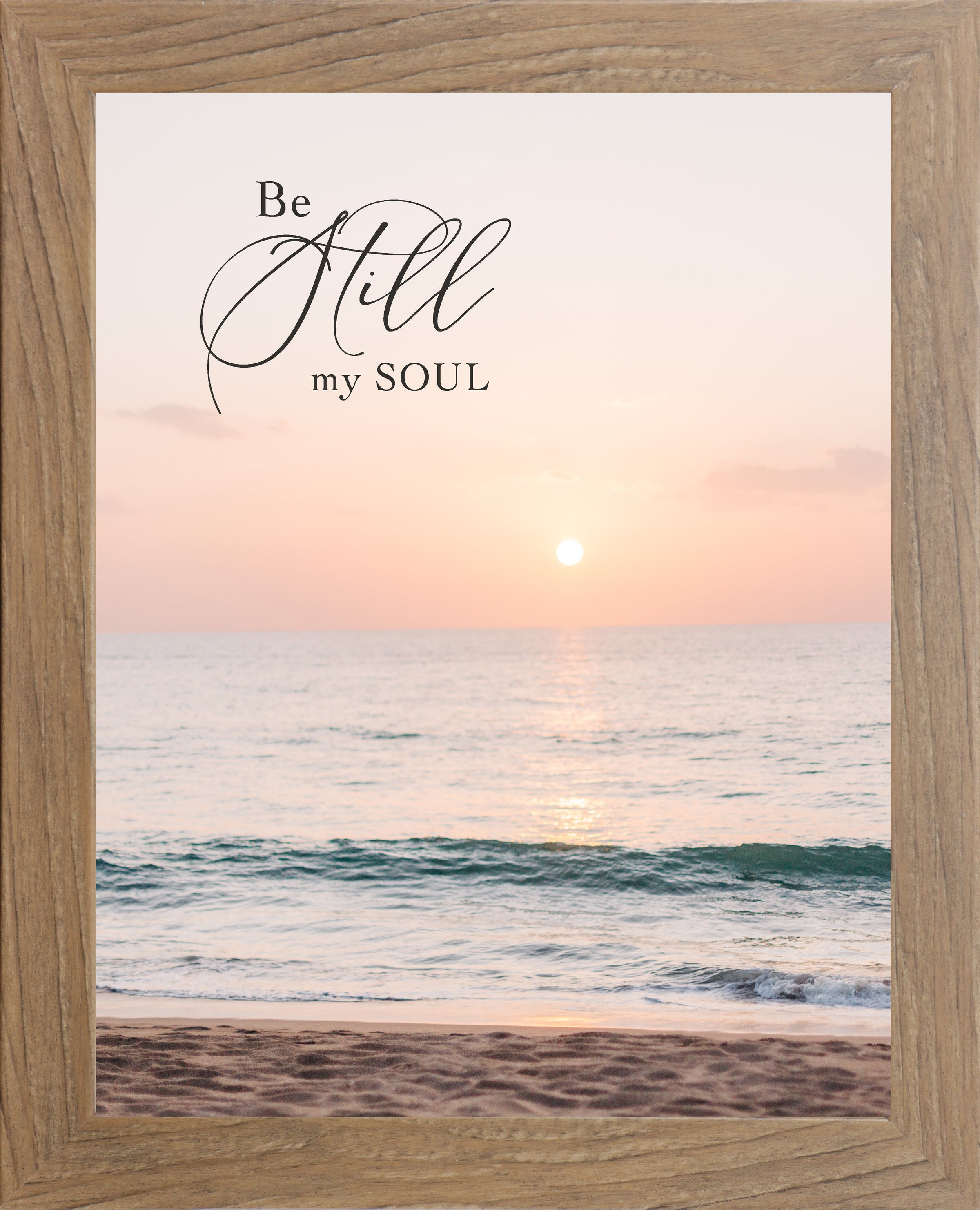 Farmtable framed portrait Christian wall art with the words Be Still My Soul in elegant script set against a soft peach and coral beach sunset with teal ocean waves and sandy shoreline