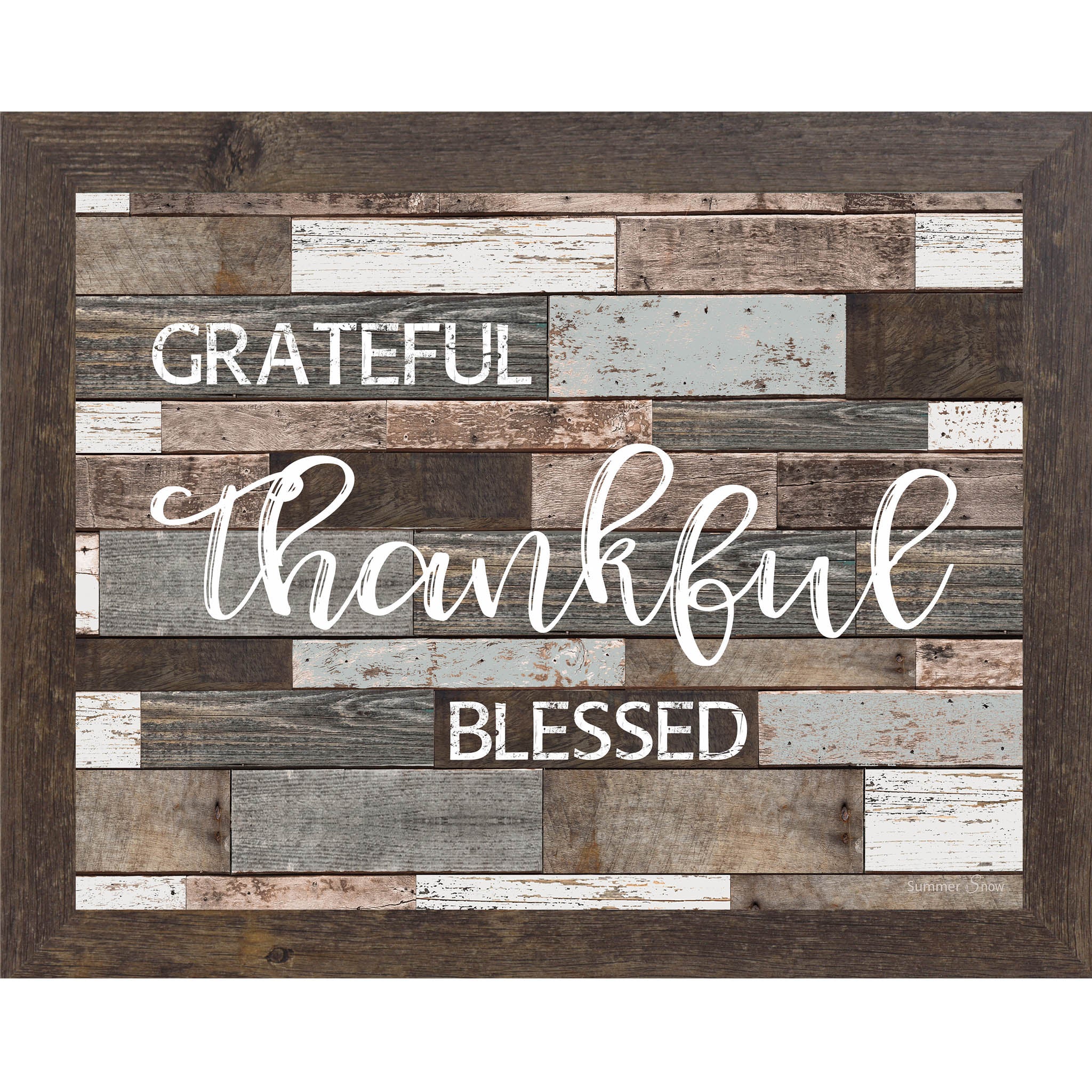 Inspirational framed wall art with the words “Grateful Thankful Blessed” on a neutral slatted wood background in a rustic farmhouse style