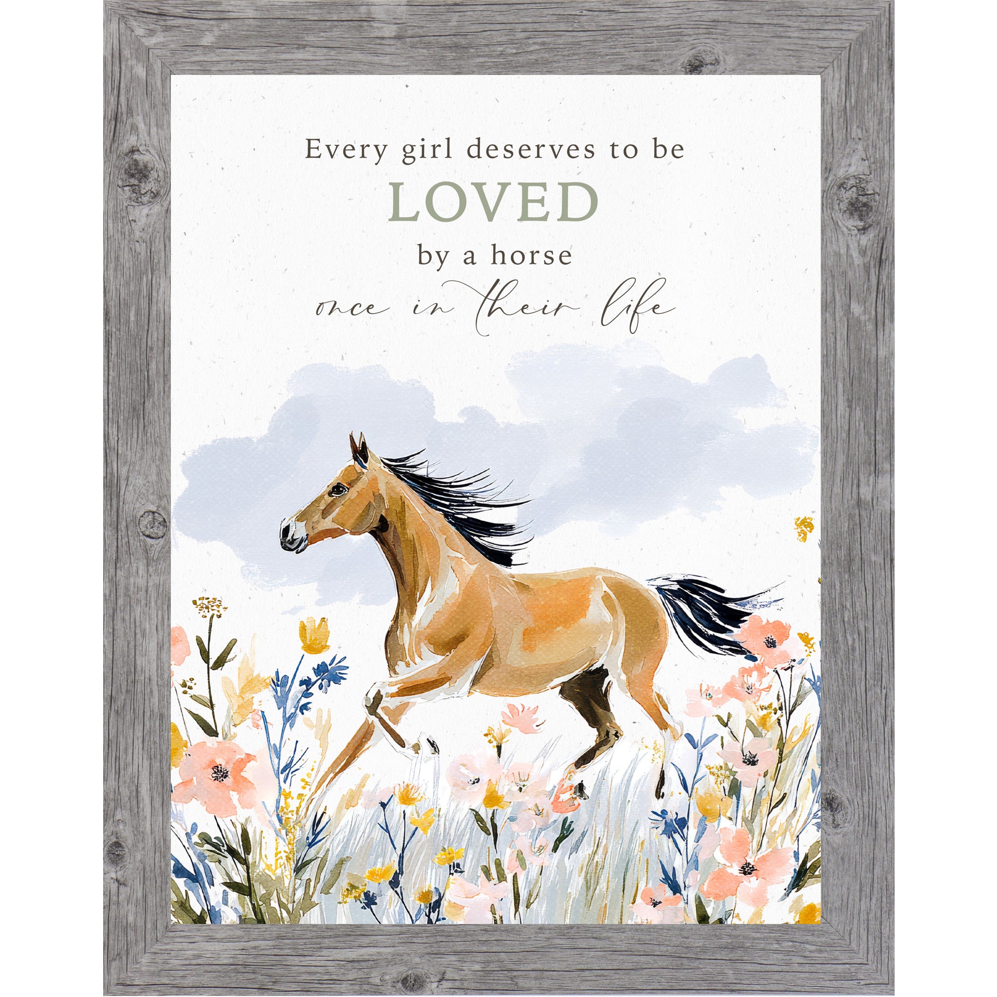 Gray framed portrait watercolor horse wall art with the words Every Girl Deserves to be Loved by a Horse Once in Their Life above a buckskin horse galloping through a pink yellow and blue wildflower meadow