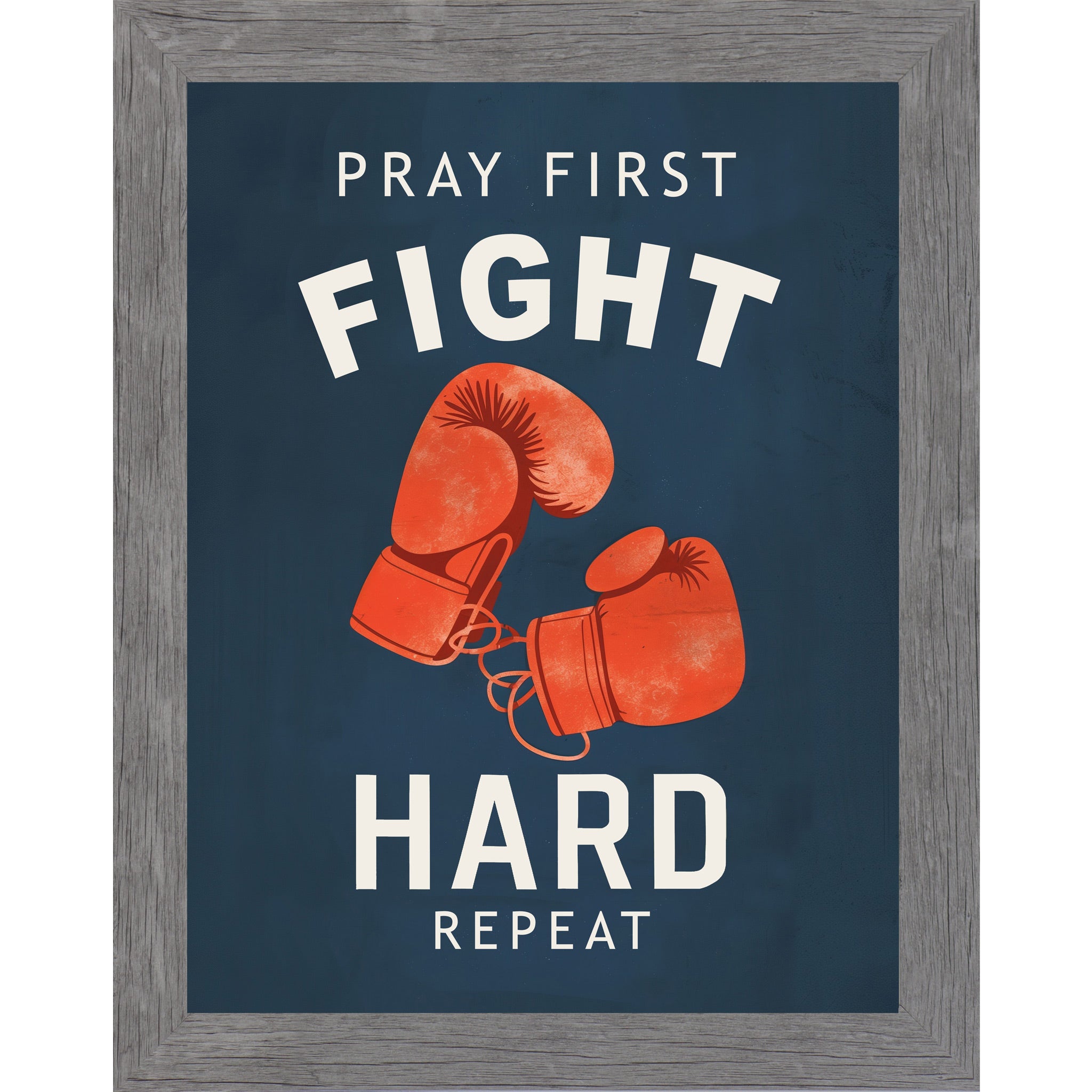 Gray framed portrait Christian boxing wall art on navy blue background with bold cream varsity typography and vivid red boxing gloves with the words Pray First Fight Hard Repeat — SB262