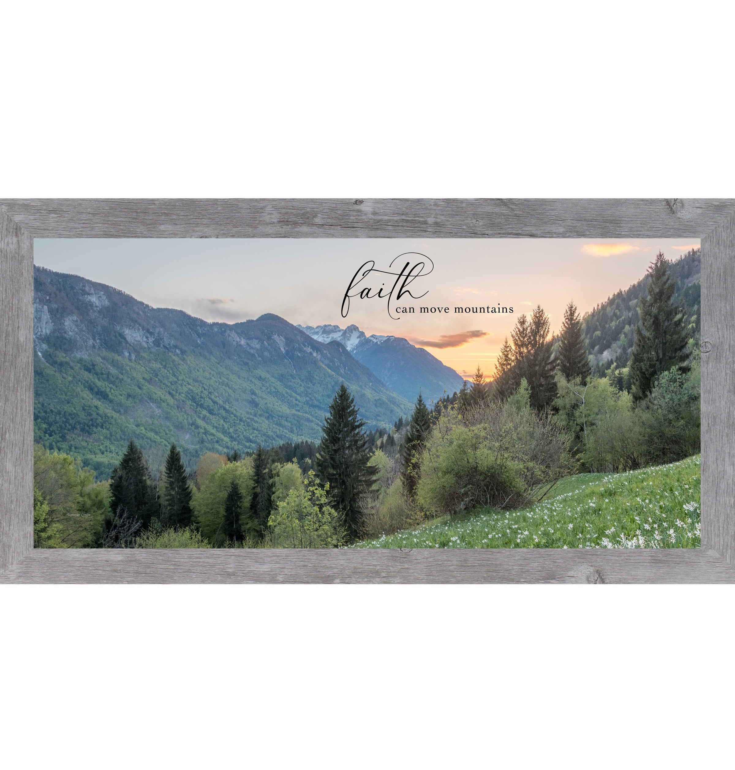 Gray framed wide landscape inspirational wall art featuring mountain valley at sunrise with summer trees and wildflowers and the quote "Faith Can Move Mountains"
