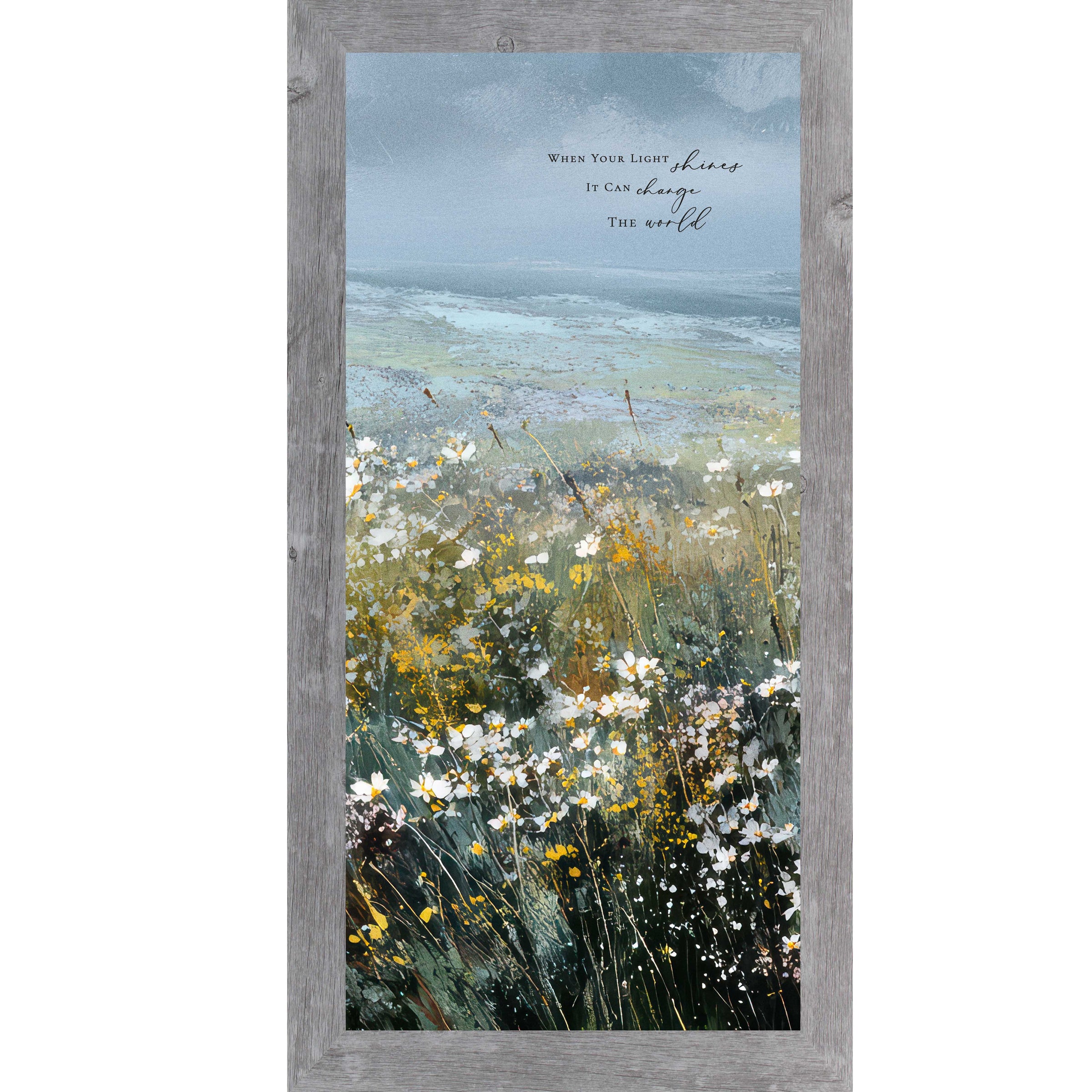 Gray color Framed inspirational wall art featuring a watercolor meadow of wildflowers in bloom with rolling fields and a soft blue sky. The artwork includes the quote “When Your Light Shines It Can Change The World.”