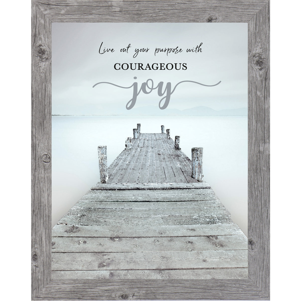 Inspirational framed wall art featuring a misty lake with a wooden pier leading into calm water and mountains, with the words “Live out your purpose with courageous joy”
