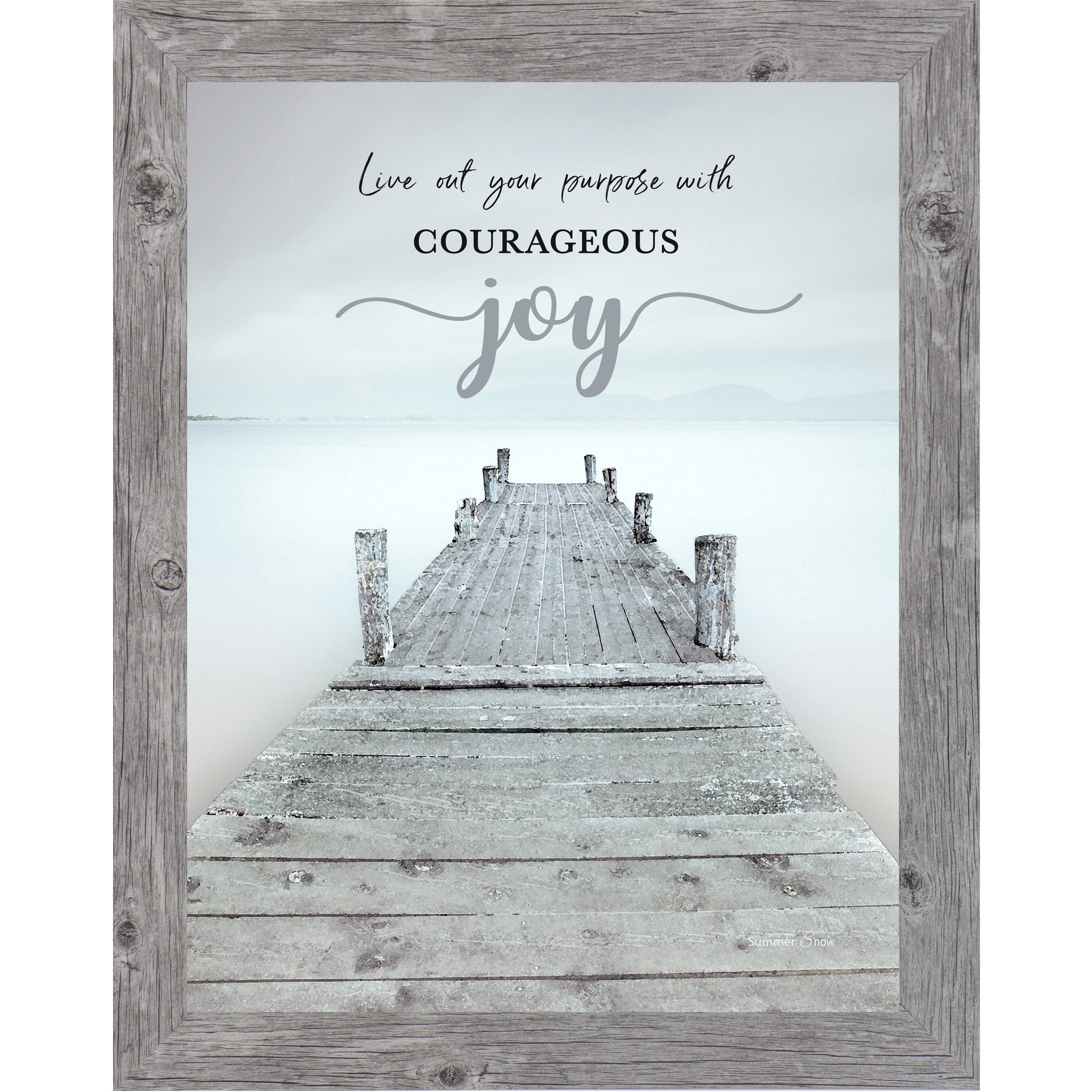 Inspirational framed wall art featuring a misty lake with a wooden pier leading into calm water and mountains, with the words “Live out your purpose with courageous joy”