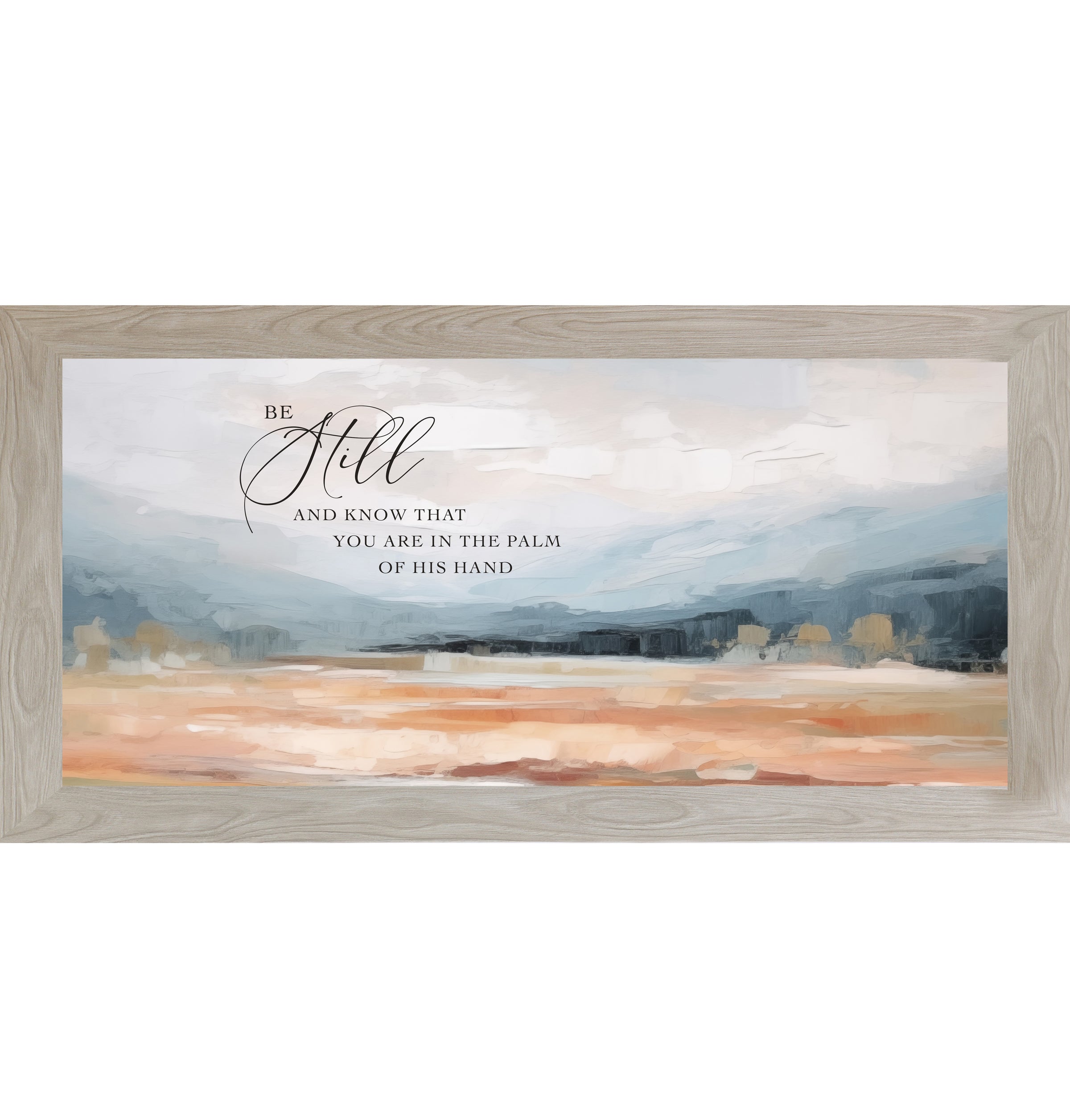 Monte Carlo framed wide landscape Christian wall art with Be Still And Know That You Are In The Palm Of His Hand scripture in oversized script over dramatic blue-grey mountains and soft peach blush terracotta field