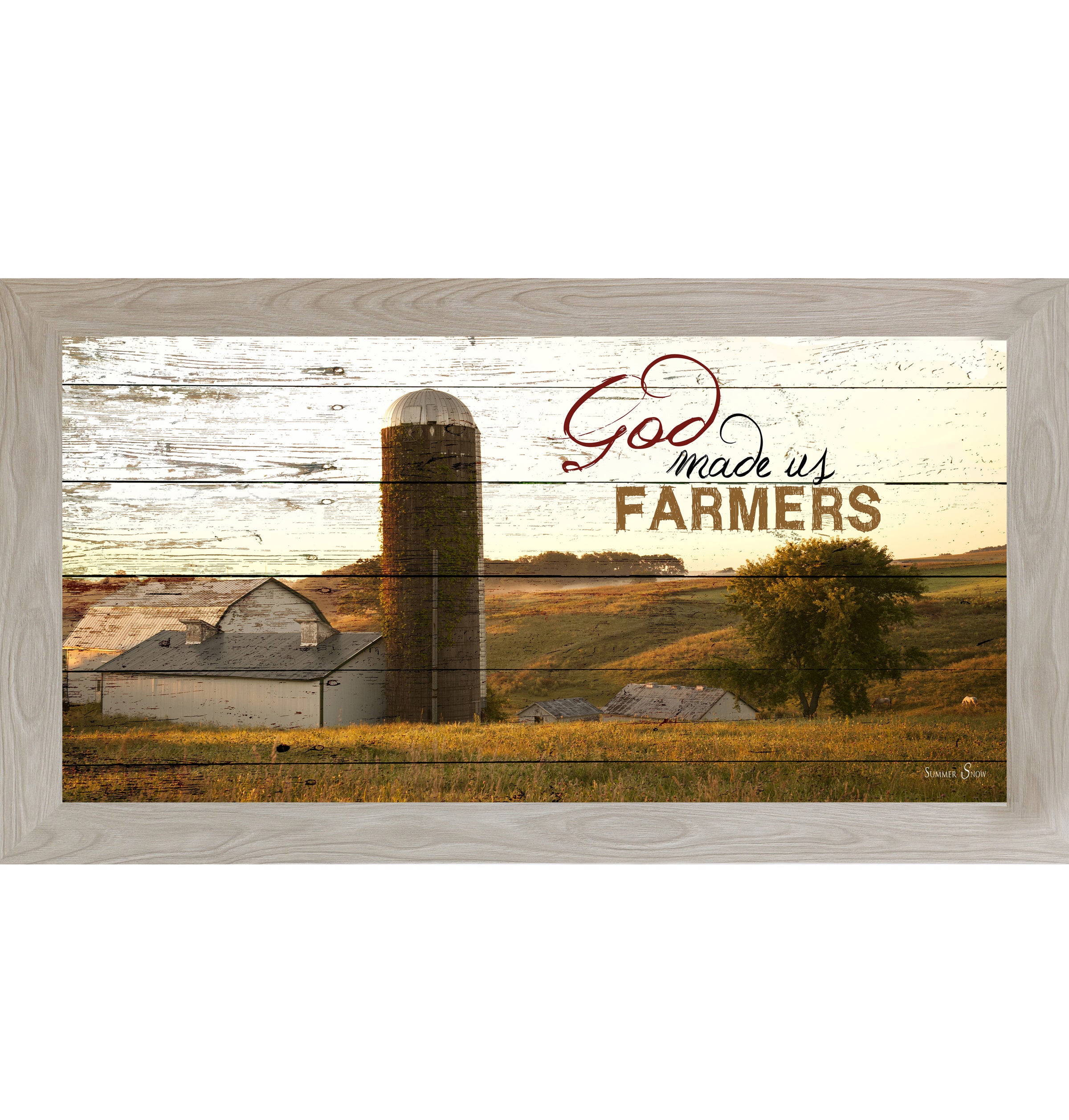 Monte Carlo framed wide panoramic farmhouse wall art featuring a white barn and silo on rolling golden hills with pallet wood background and the words God Made Us Farmers
