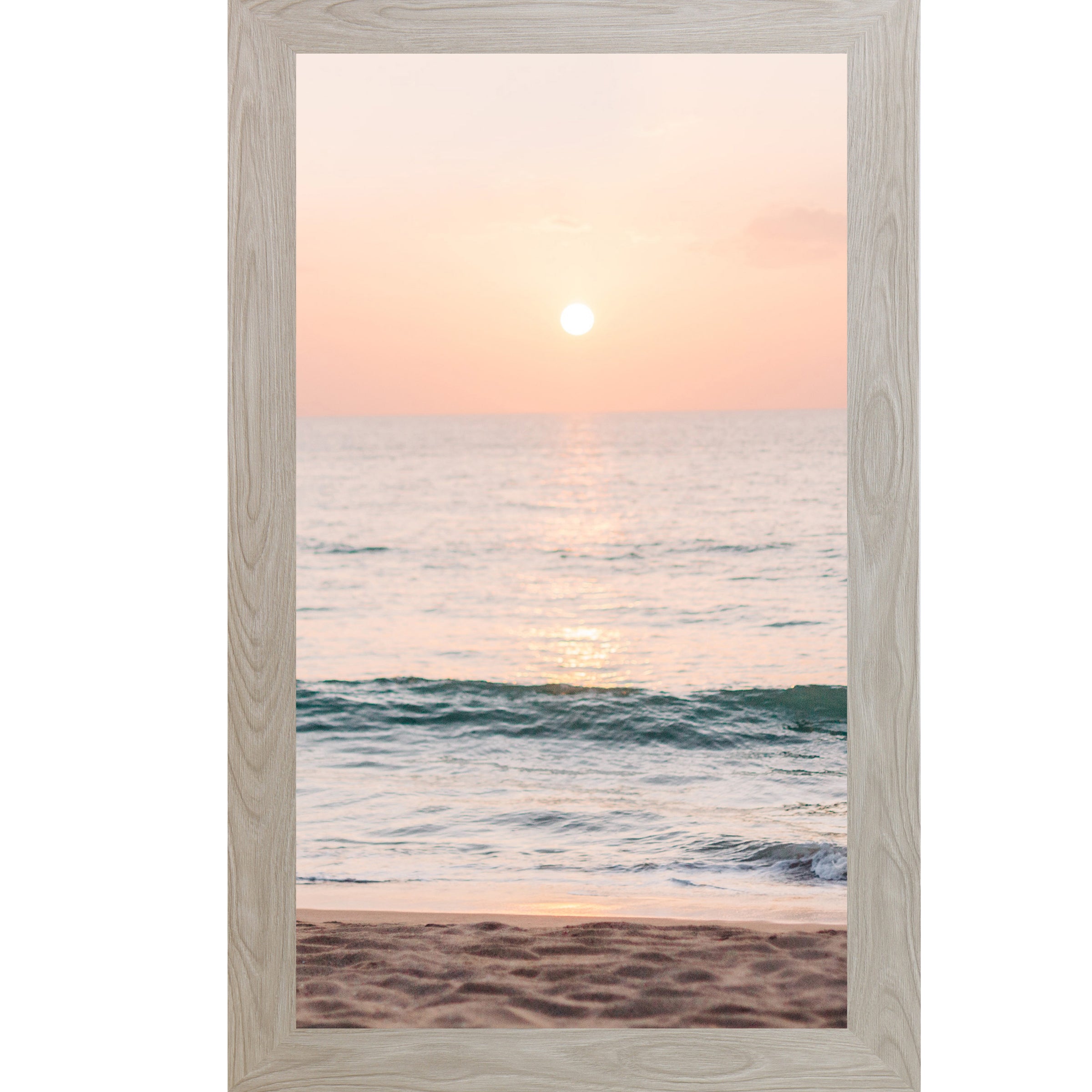 Monte Carlo framed tall portrait beach sunset wall art featuring a glowing sun above the horizon with soft peach and coral sky, shimmering teal ocean waves, and sandy shoreline