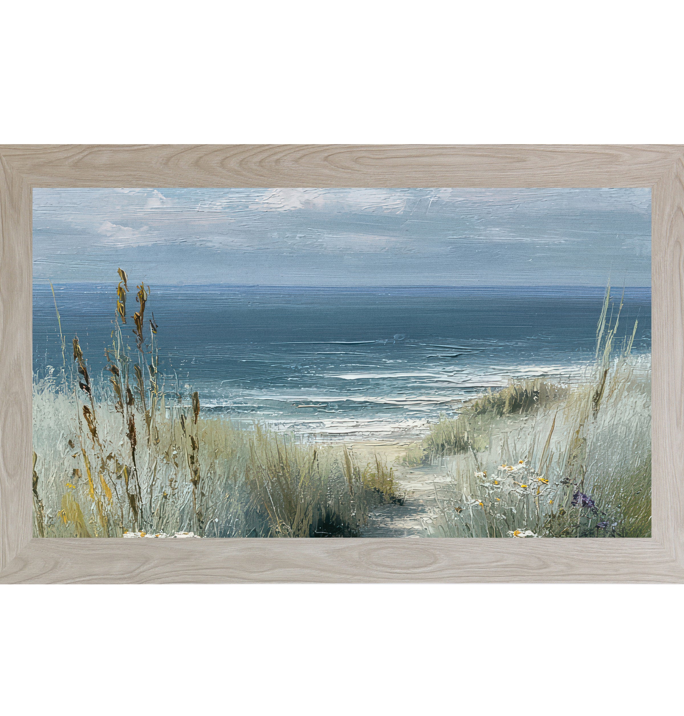 Monte Carlo framed wide landscape coastal path wall art featuring golden cattails and sea grasses with white and yellow wildflowers framing a sandy beach path leading to deep teal ocean under a soft blue gray sky