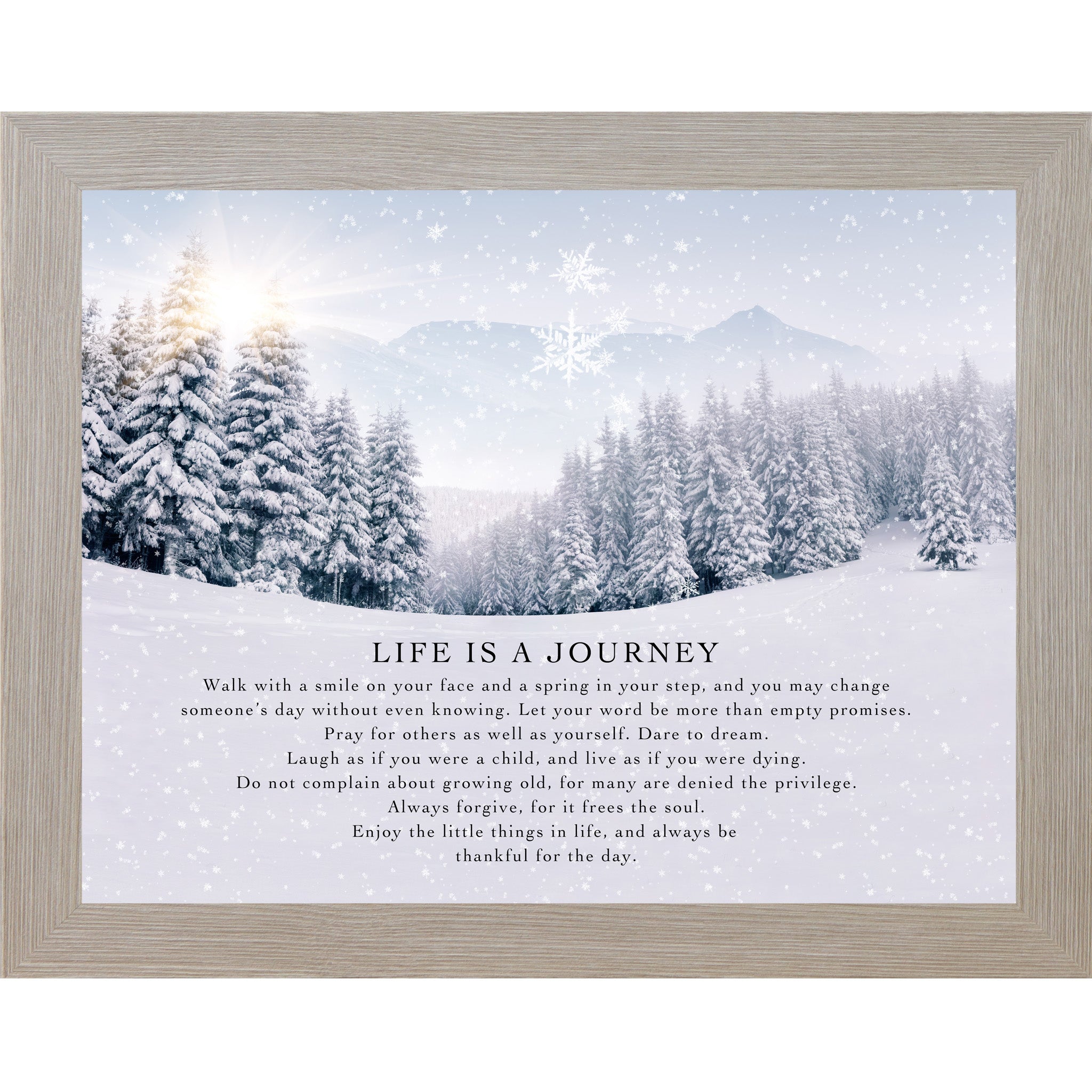 Monte Carlo framed landscape winter wall art featuring a sunlit snowy pine forest with falling snowflakes and the words "Life Is A Journey" followed by an inspirational life philosophy