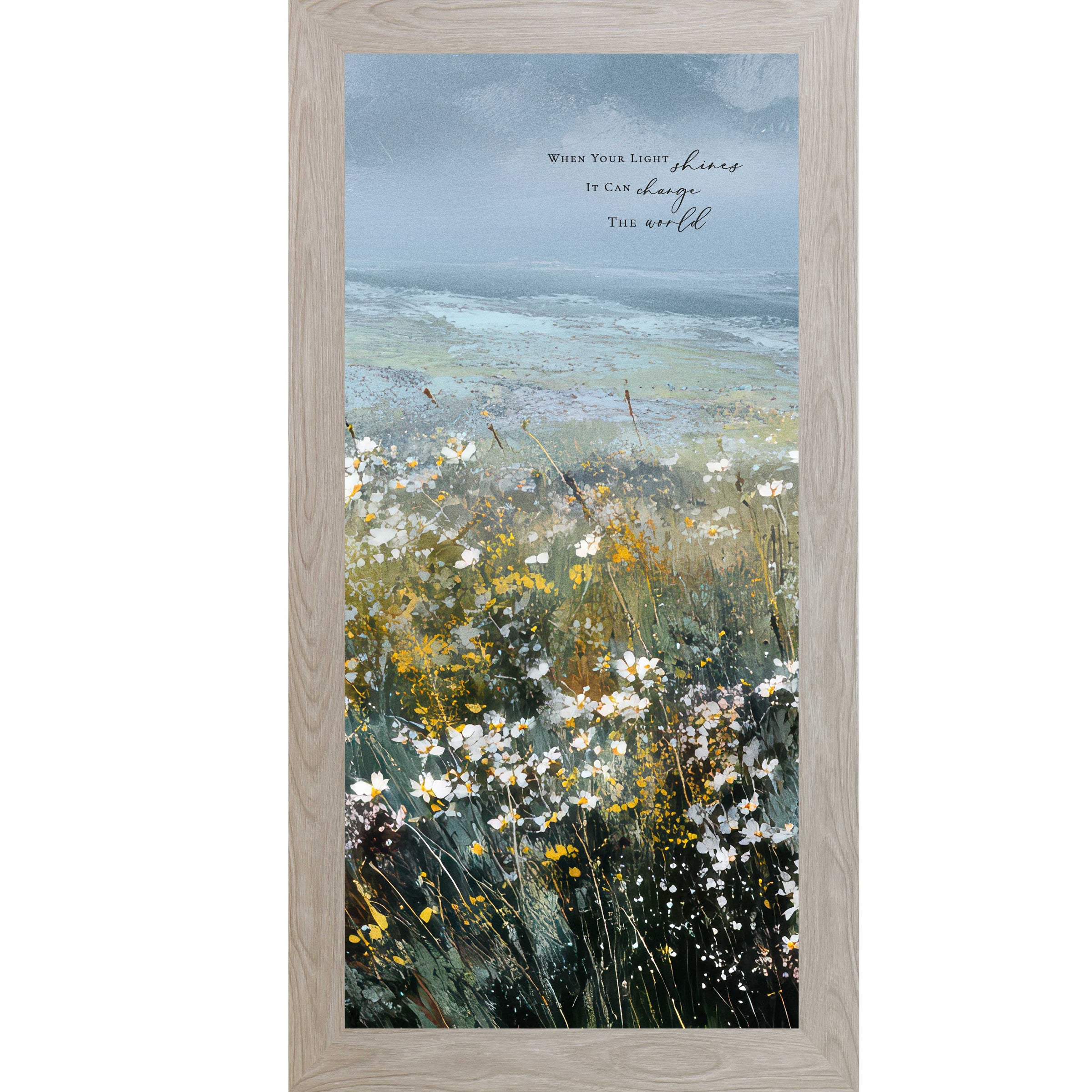 Monte Carlo color Framed inspirational wall art featuring a watercolor meadow of wildflowers in bloom with rolling fields and a soft blue sky. The artwork includes the quote “When Your Light Shines It Can Change The World.”