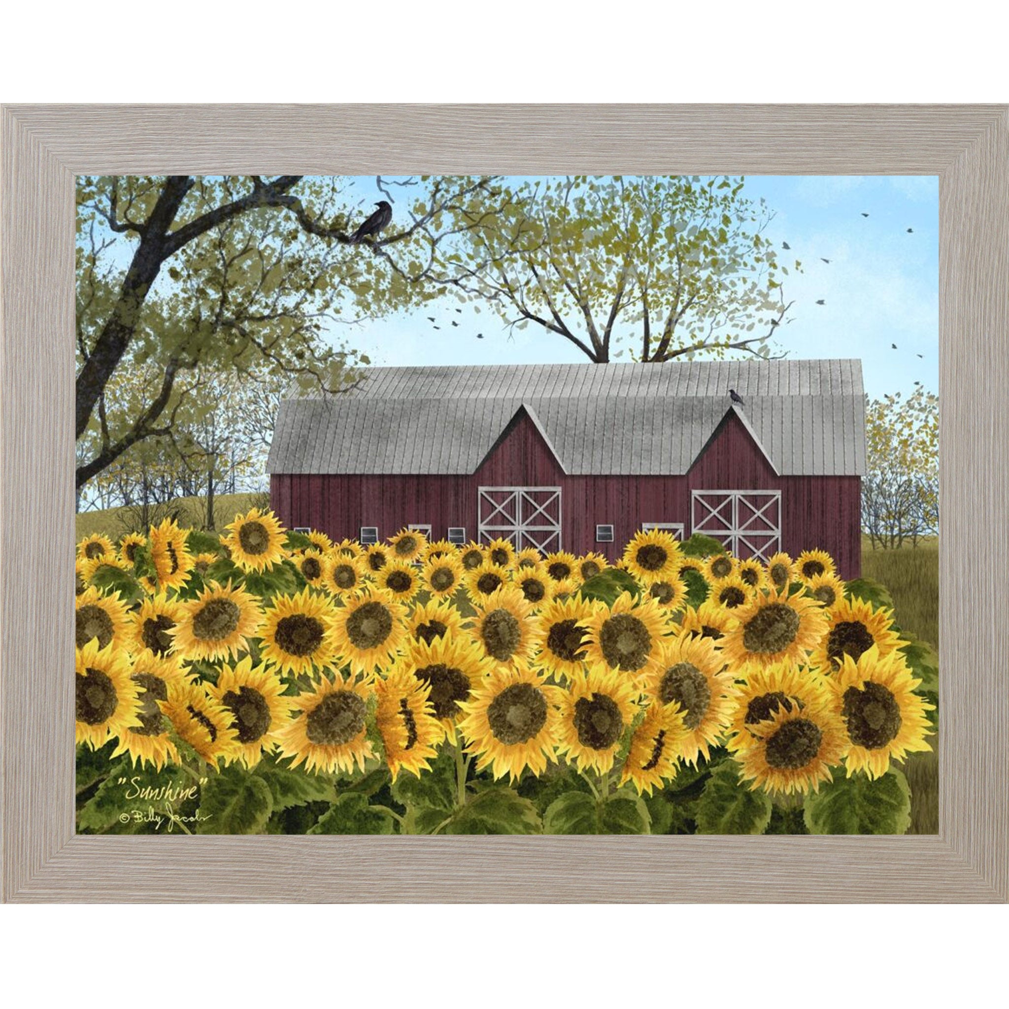 Monte Carlo framed Billy Jacobs Sunshine wall art featuring a sweeping field of golden sunflowers in full bloom before a classic red barn with white cross doors bare tree branches with a crow and pale blue sky