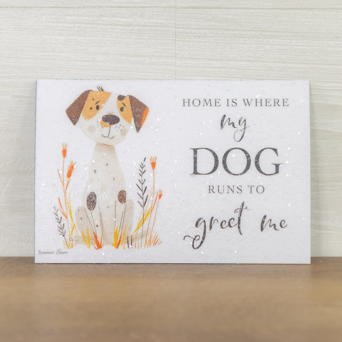 Home Is Where My Dog Runs To Greet Me magnet – 4x6 horizontal cartoon dog in tall grass with brown patches and dark ears, glittered acrylic finish