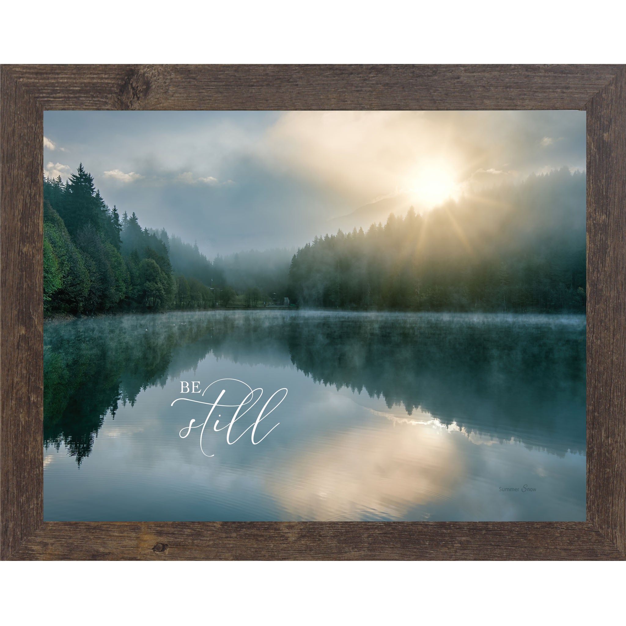 Natural brown framed landscape Christian wall art with realistic lake reflection of trees and sunrise with the words "Be Still" reflected in the water Psalm 46:10
