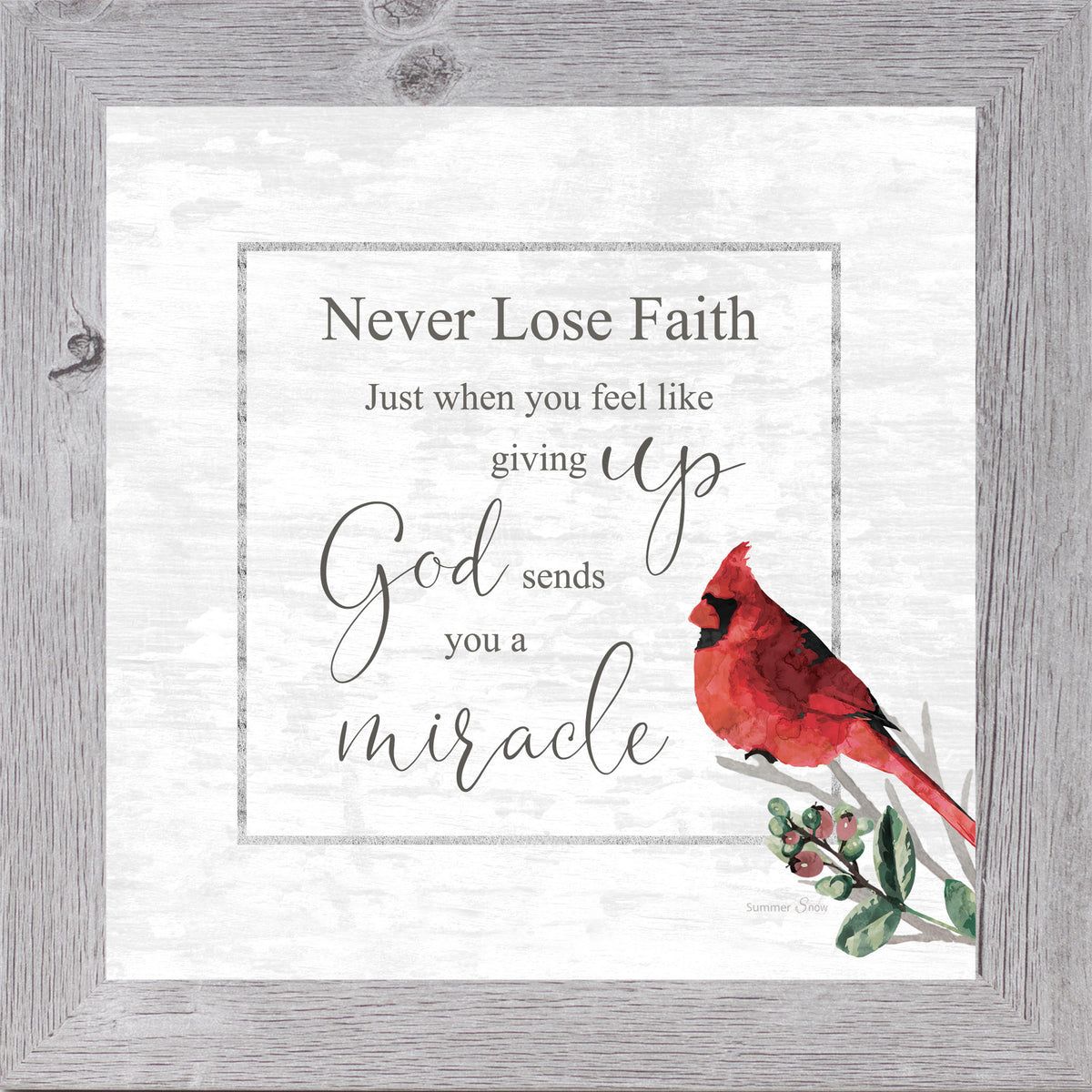 Inspirational framed wall art with a red cardinal on a green berry branch and the words “Never lose faith” inside a bordered design