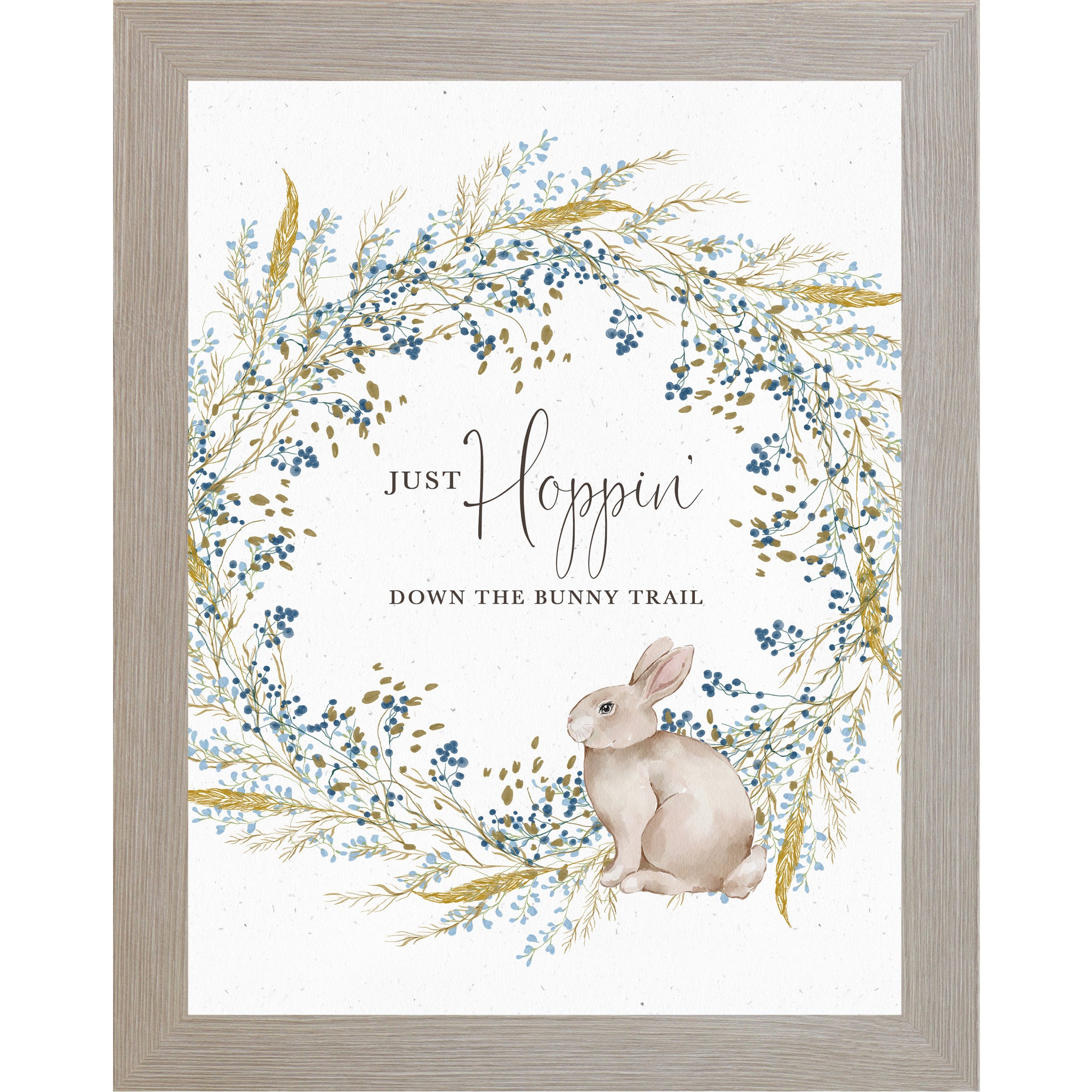 Watercolor spring bunny wall art with a blue and teal floral wreath and the phrase “Just Hoppin’ Down the Bunny Trail” on a neutral background