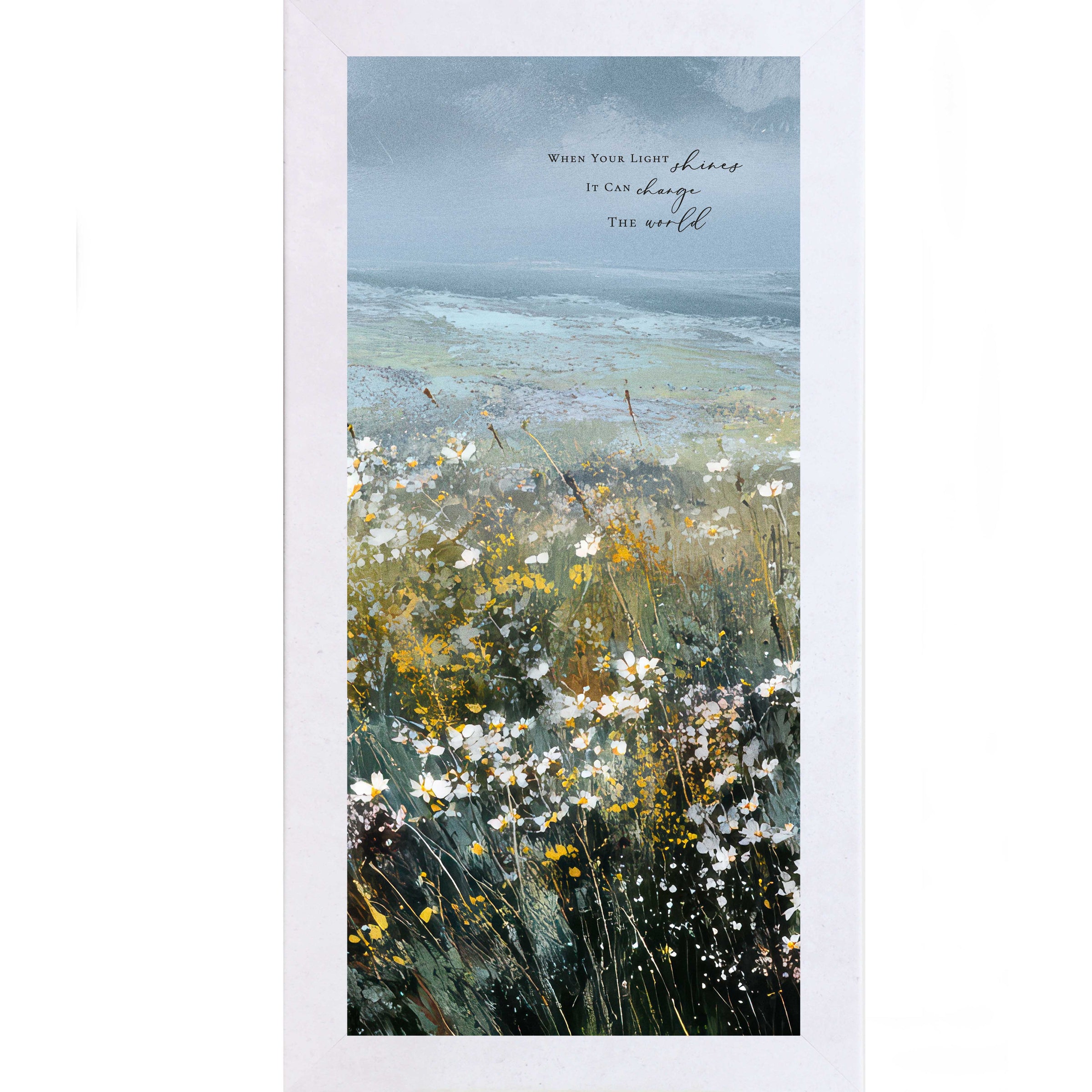 Terracotta White Color Framed inspirational wall art featuring a watercolor meadow of wildflowers in bloom with rolling fields and a soft blue sky. The artwork includes the quote “When Your Light Shines It Can Change The World.”