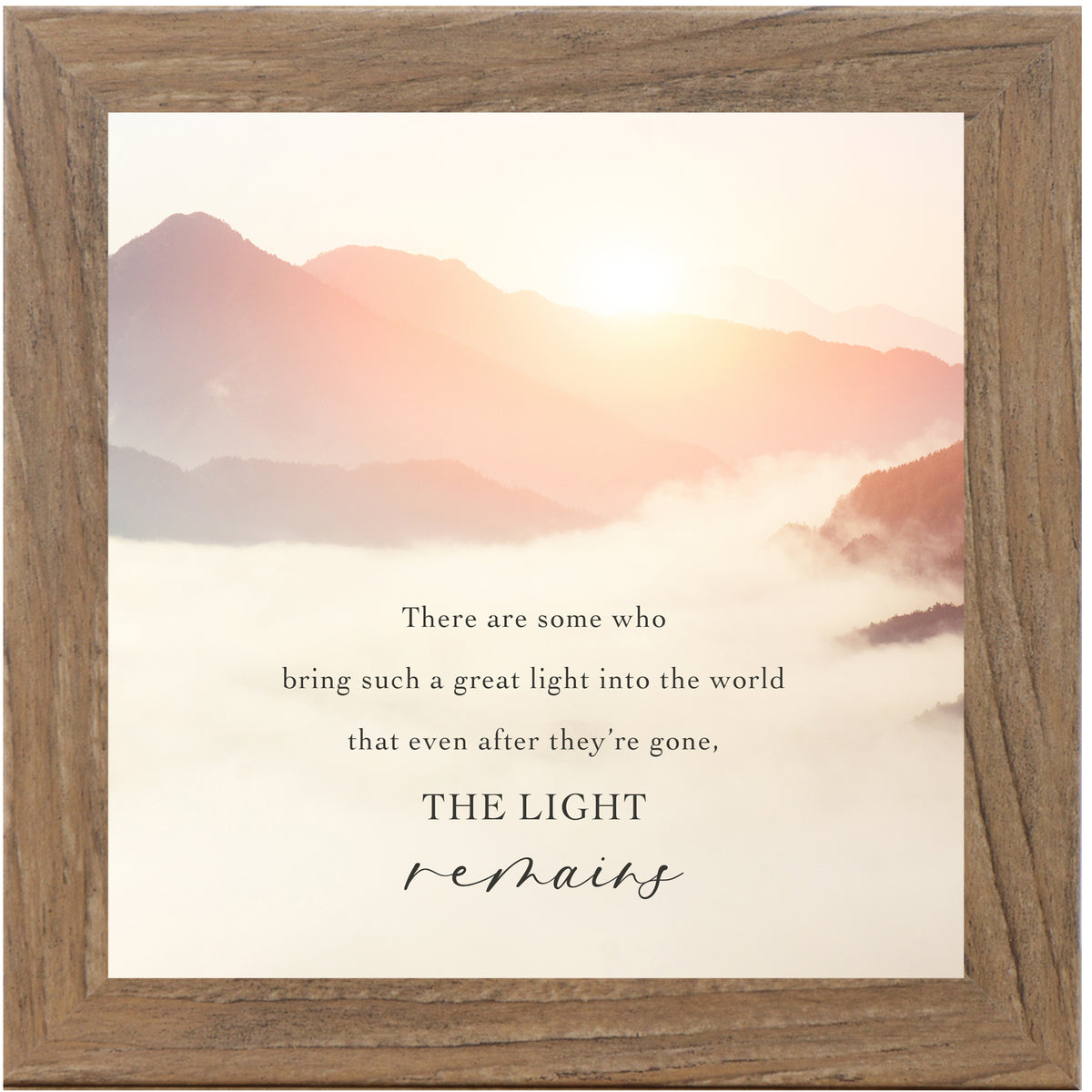 Inspirational framed wall art featuring The Light Remains quote over a misty morning mountain landscape with soft light and neutral tones, calming nature decor