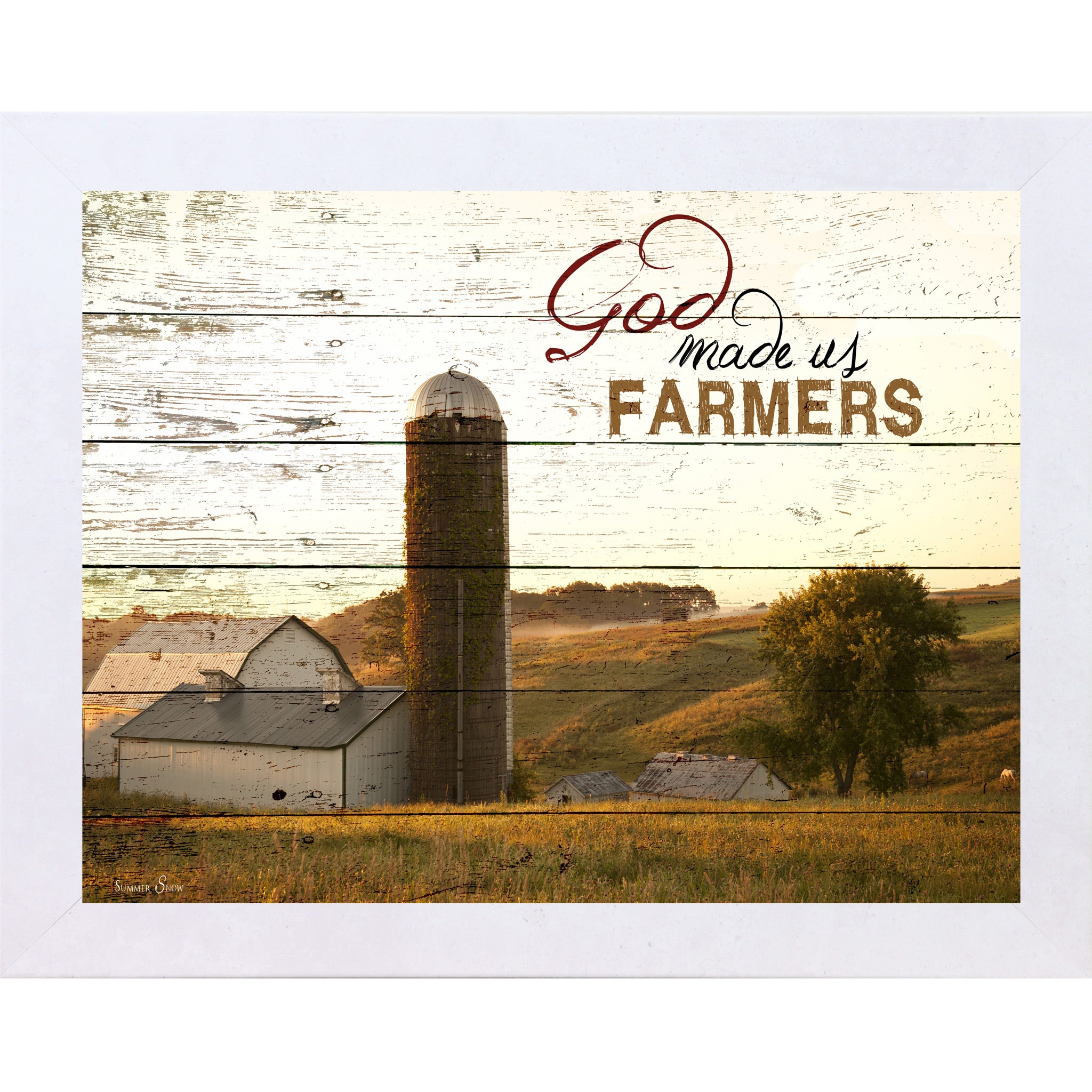 Terracotta White framed horizontal farmhouse landscape wall art featuring a white barn and silo on rolling green hills with pallet wood background and the words God Made Us Farmers