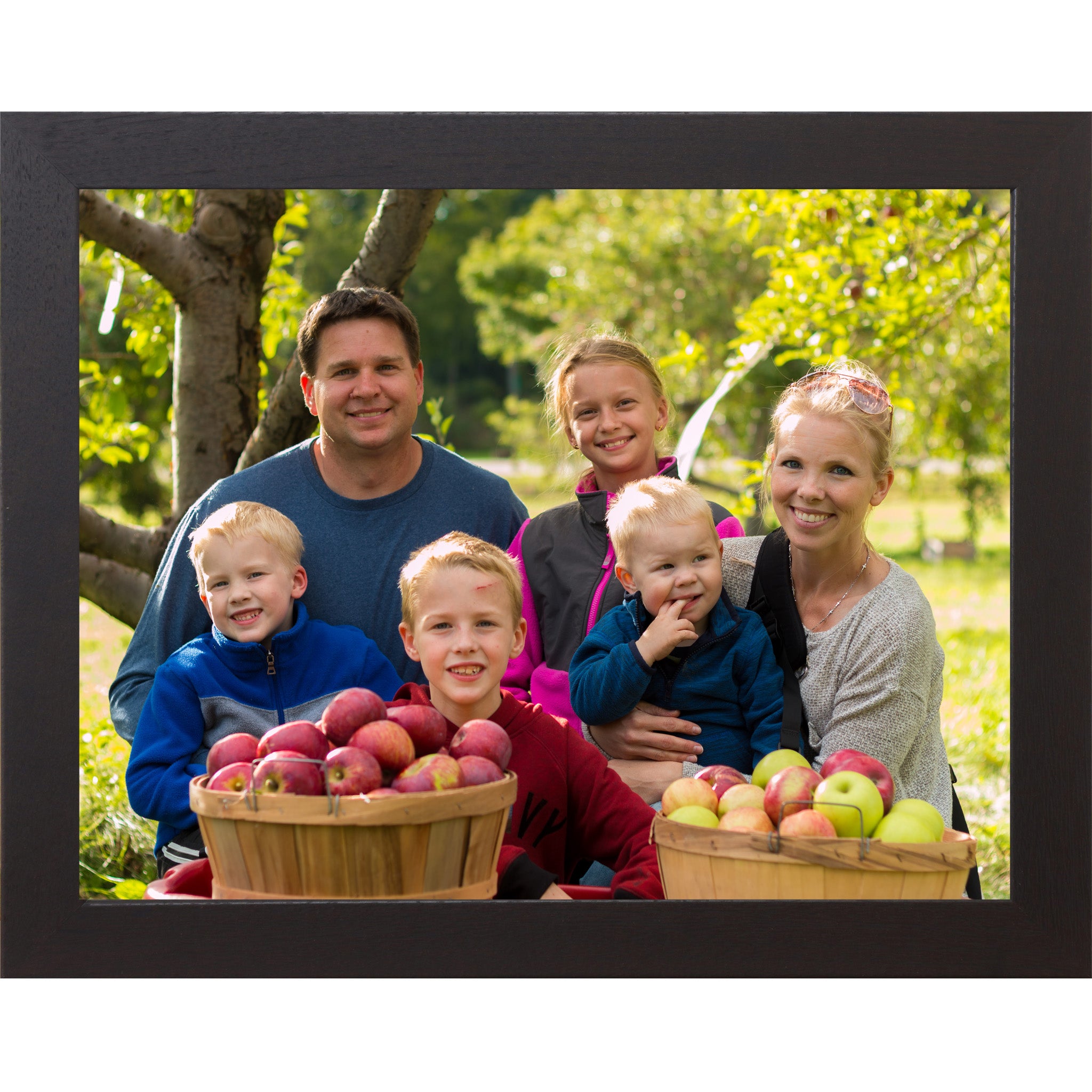 Black framed horizontal custom photo print showing a professionally framed family photograph in a black 1 inch MDF frame with canvas finish