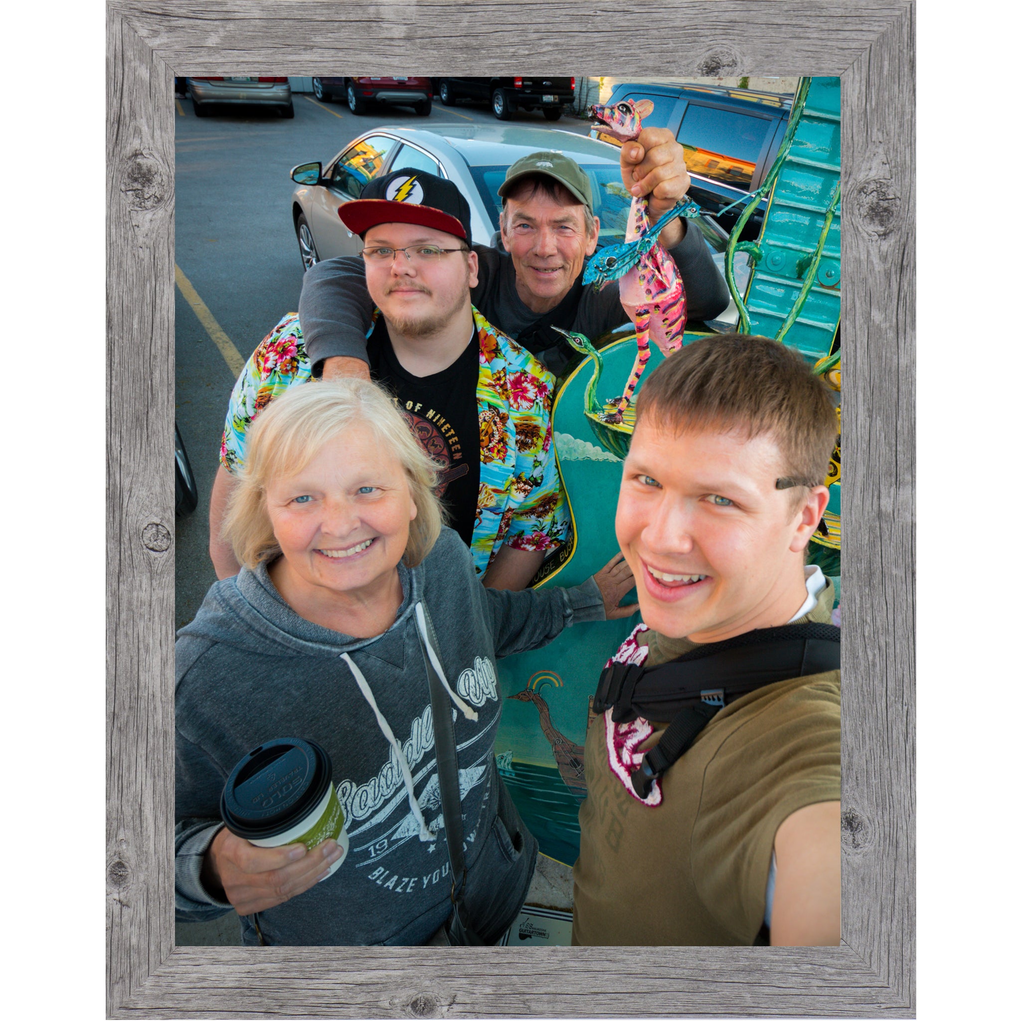 Gray framed vertical custom photo print showing a professionally framed family photograph in a gray 1 inch MDF frame with canvas finish